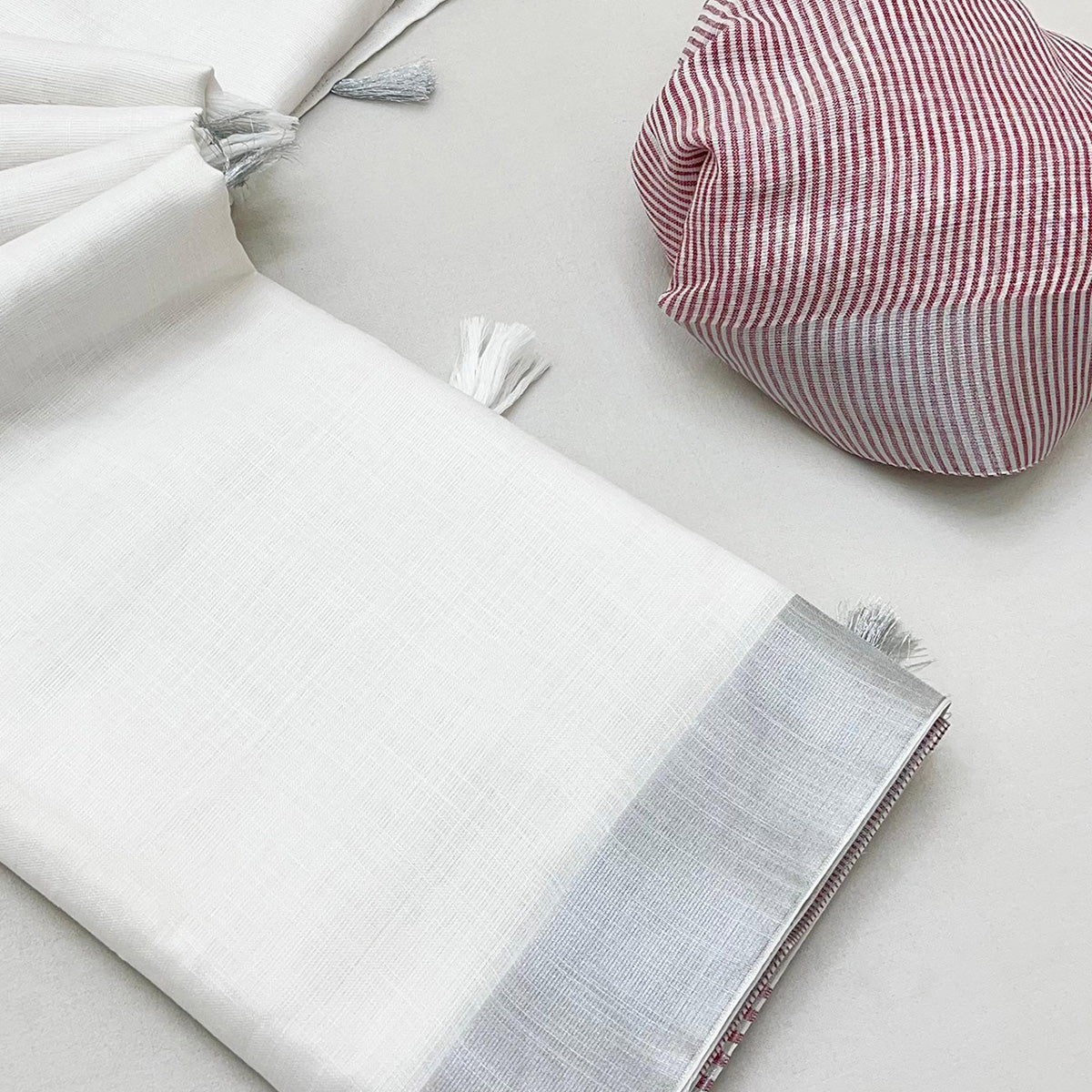 White & Wine Zari Woven Linen Saree With Tassels