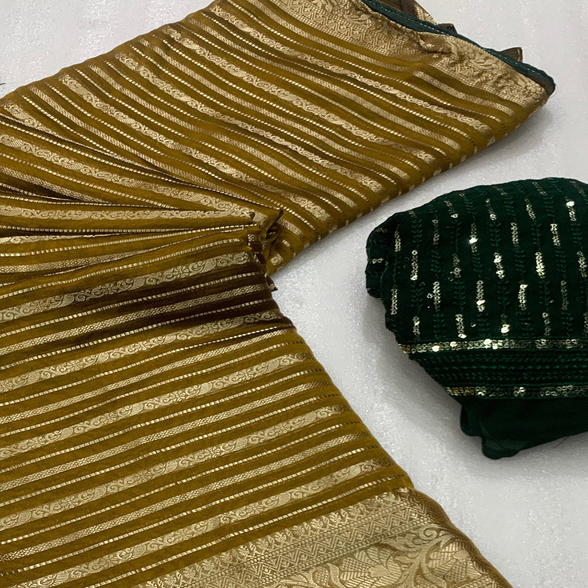 Mustard Woven Georgette Saree With Tassels