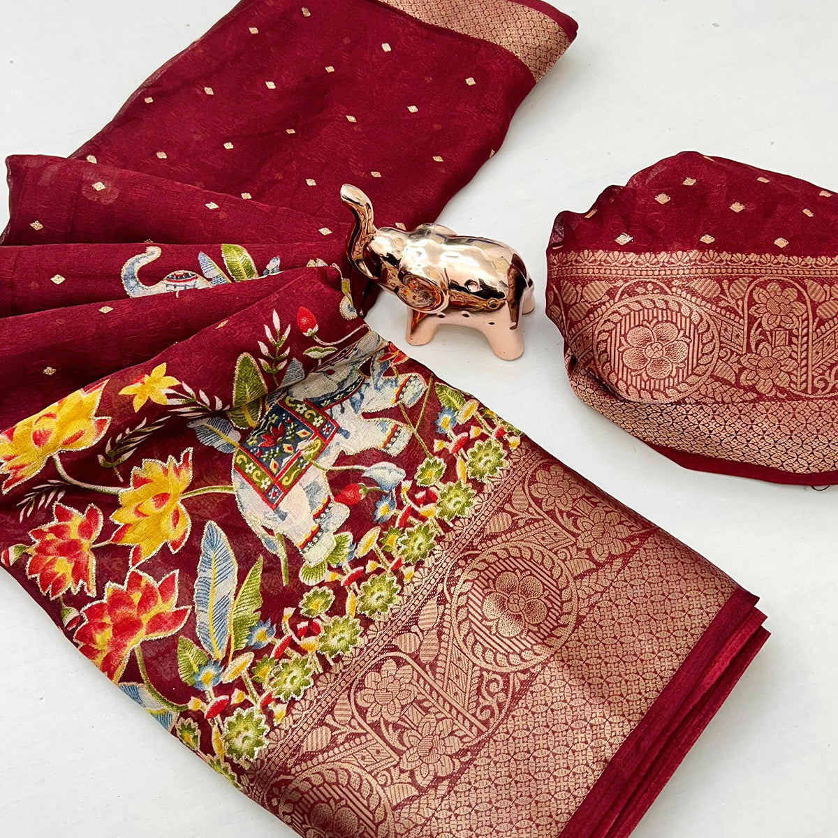 Elegant Maroon Elephant & Floral Printed Georgette Saree Accented With Gleaming Weaving Zari Border