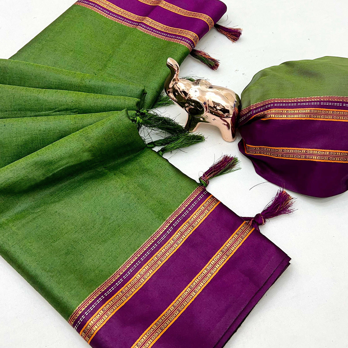 Classic Green Solid Weaving Pure Silk Saree Accented With Woven Striped Pallu & Tassel Finish