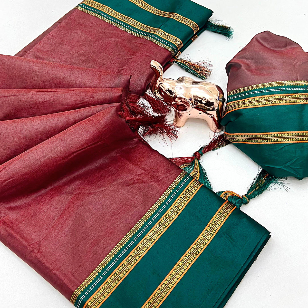 Classic Maroon Solid Weaving Pure Silk Saree Accented With Woven Striped Pallu & Tassel Finish