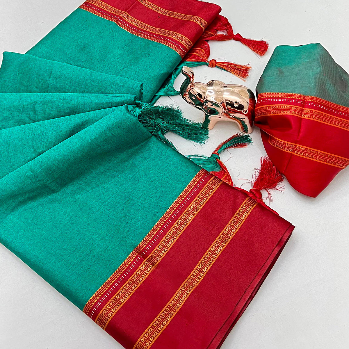 Classic Teal Green Solid Weaving Pure Silk Saree Accented With Woven Striped Pallu & Tassel Finish