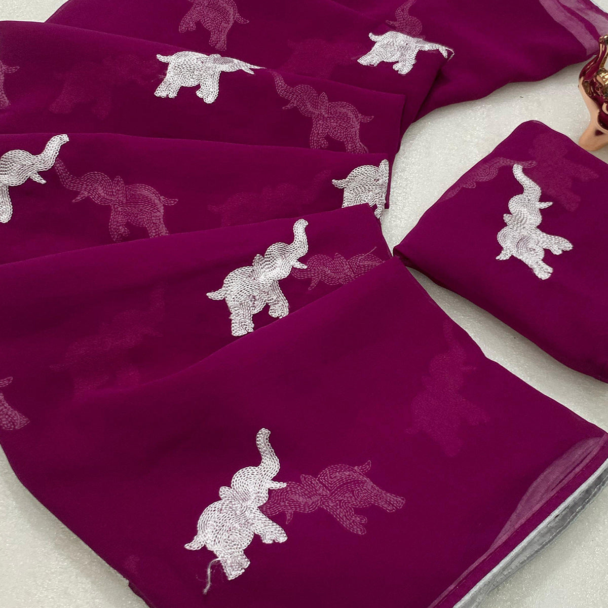 Dark Purple Georgette Saree Featuring Exquisite Elephant Embroidery