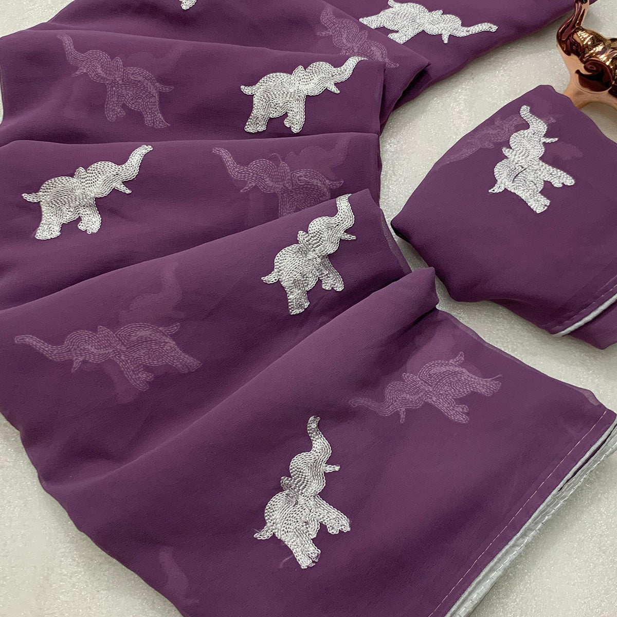 Light Purple Georgette Saree Featuring Exquisite Elephant Embroidery