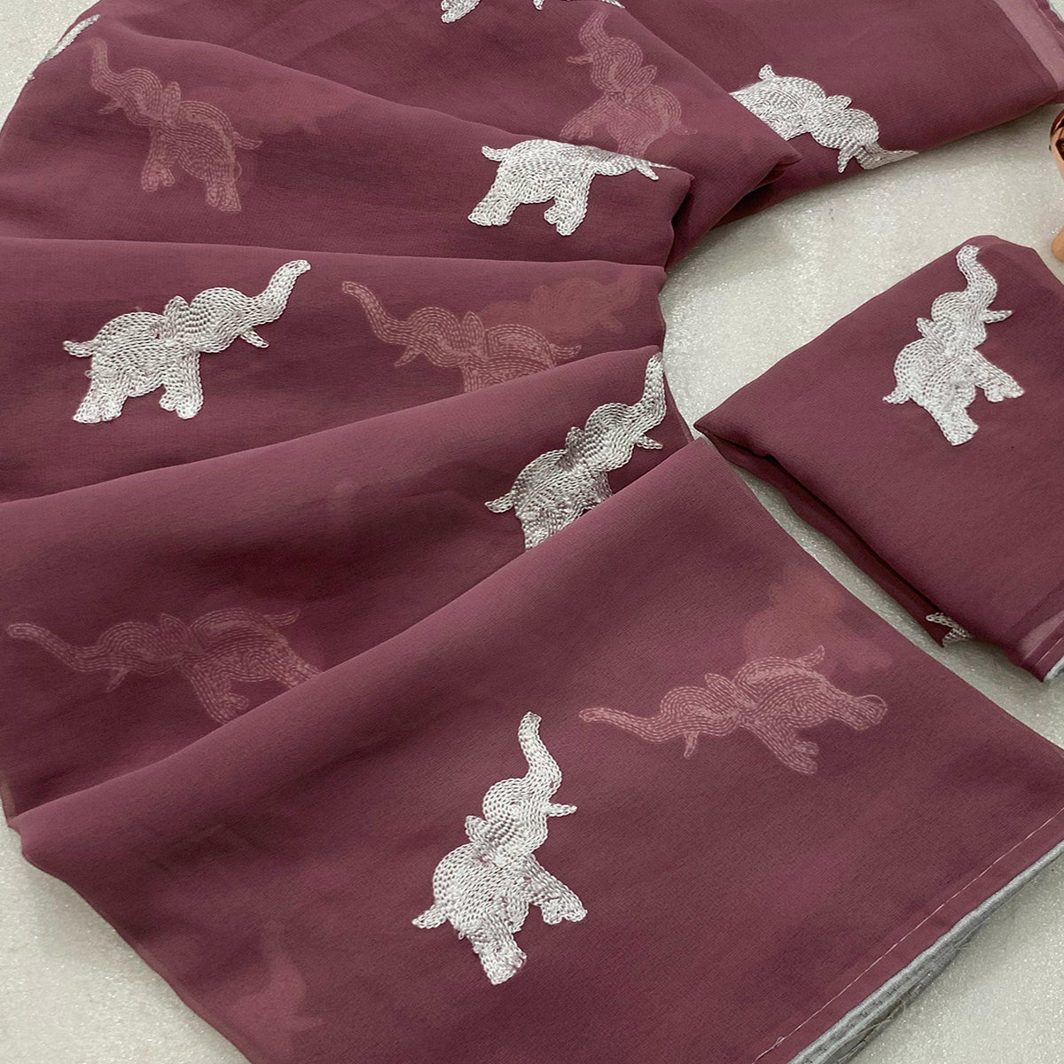 Mauve Georgette Saree Featuring Exquisite Elephant Embroidery