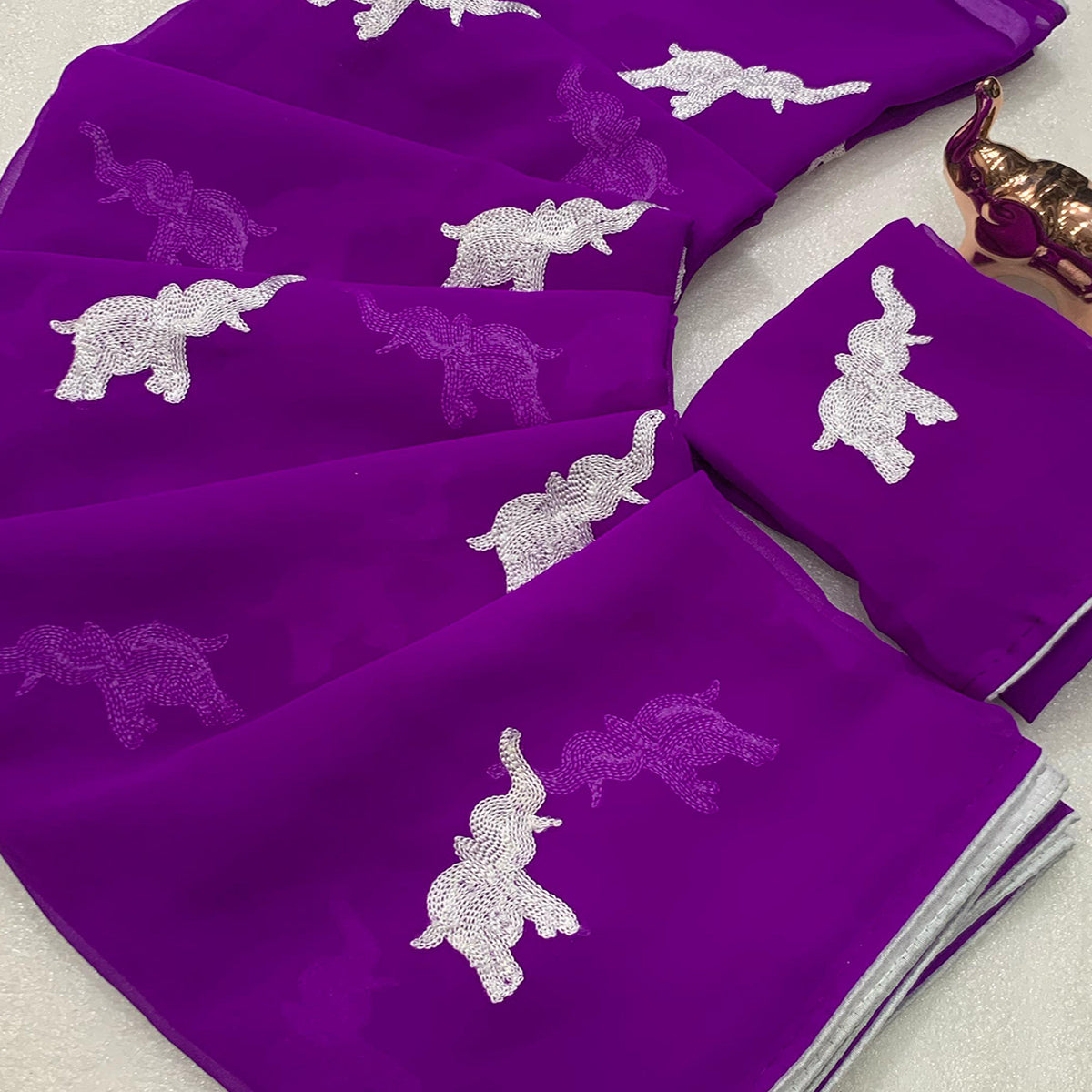 Purple Georgette Saree Featuring Exquisite Elephant Embroidery