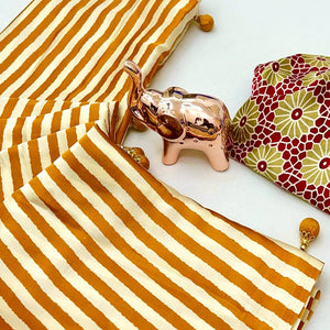Luxe Partywear Saree in Mustard Satin with Modern Striped Print and Flowing Drape