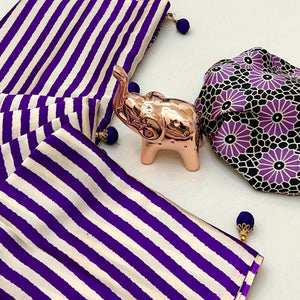 Luxe Partywear Saree in Violet Satin with Modern Striped Print and Flowing Drape