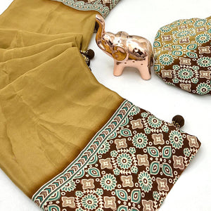 Mustard Solid Satin Saree Featuring Bold Ajrakh Print and Tassel Accented Pallu