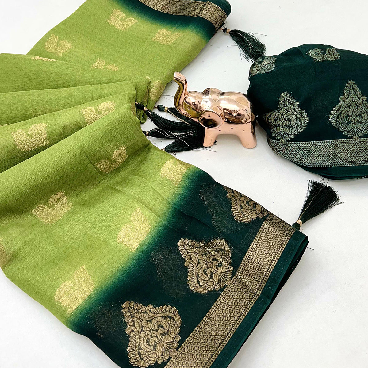 Elegant Green Peacock Pattern Zari Weaving Georgette Saree With Tassel Pallu