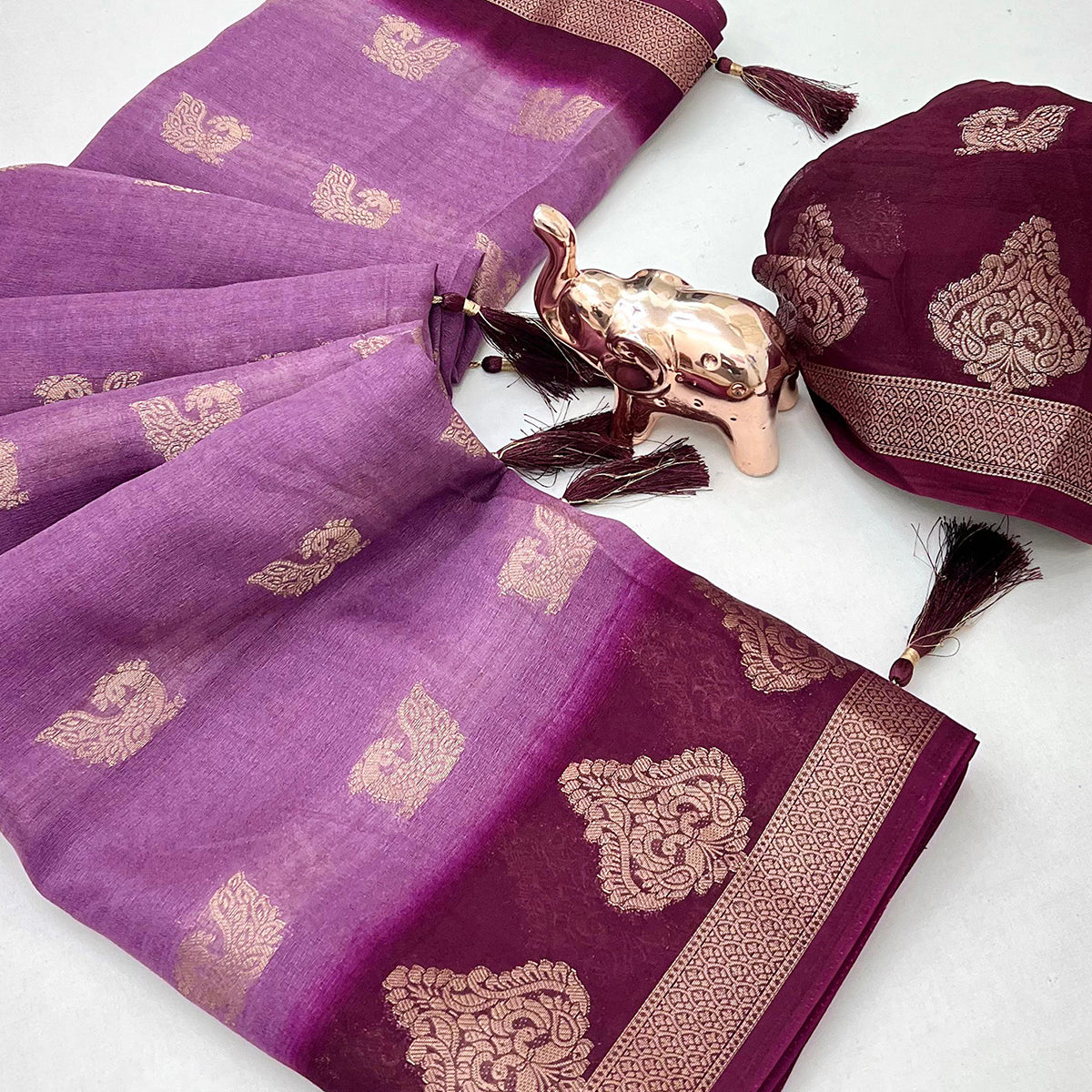 Elegant Purple Peacock Pattern Zari Weaving Georgette Saree With Tassel Pallu