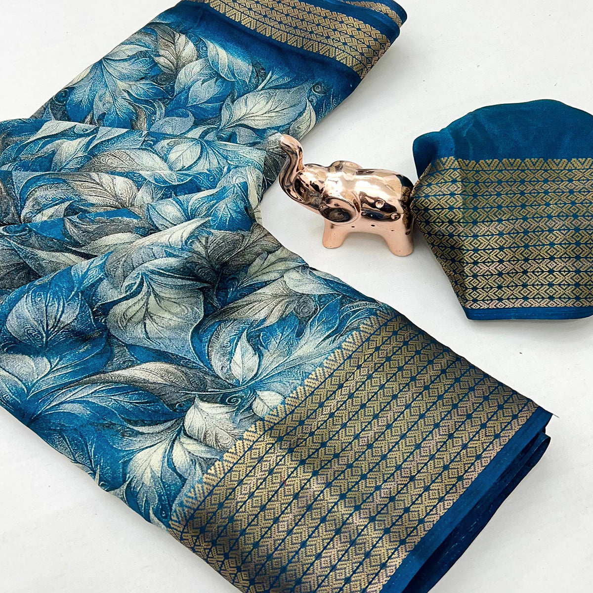 Blue Leaf Printed Dola Silk Marshmallow Saree With Paisley Jaal Pallu & Lustrous Weaving Border
