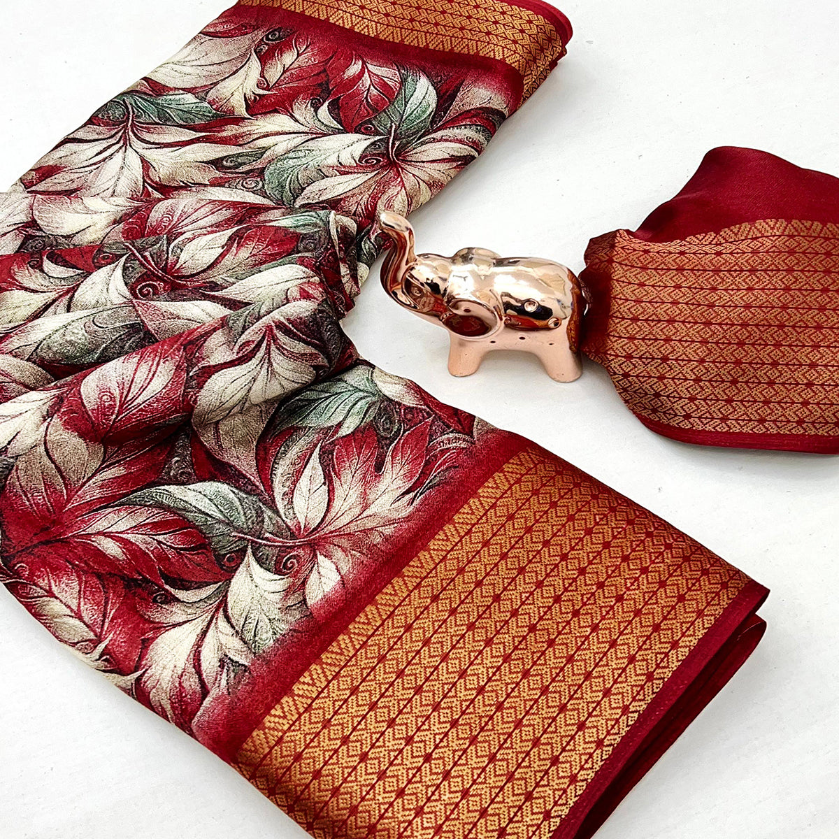 Cherry Red Leaf Printed Dola Silk Marshmallow Saree With Paisley Jaal Pallu & Lustrous Weaving Border
