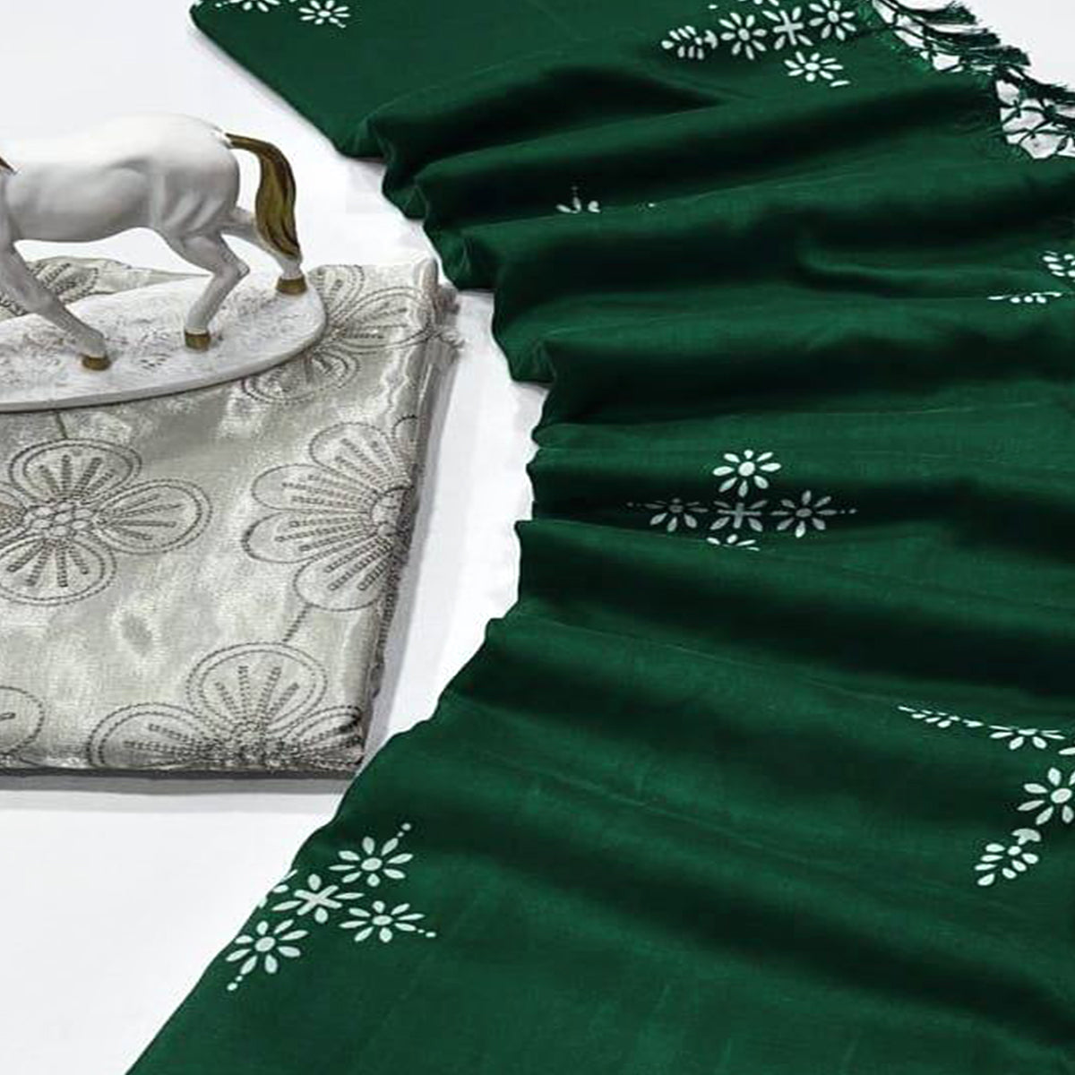 Green Muslin Cotton Silk Saree Adorned With Delicate Floral Prints & Playful Tassels