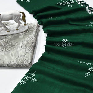 Green Muslin Cotton Silk Saree Adorned With Delicate Floral Prints & Playful Tassels