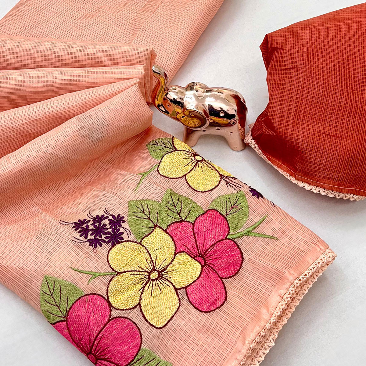 Elegant Peach Kota Doria Saree with Detailed Floral Thread Work & Premium Crochet Lace Border