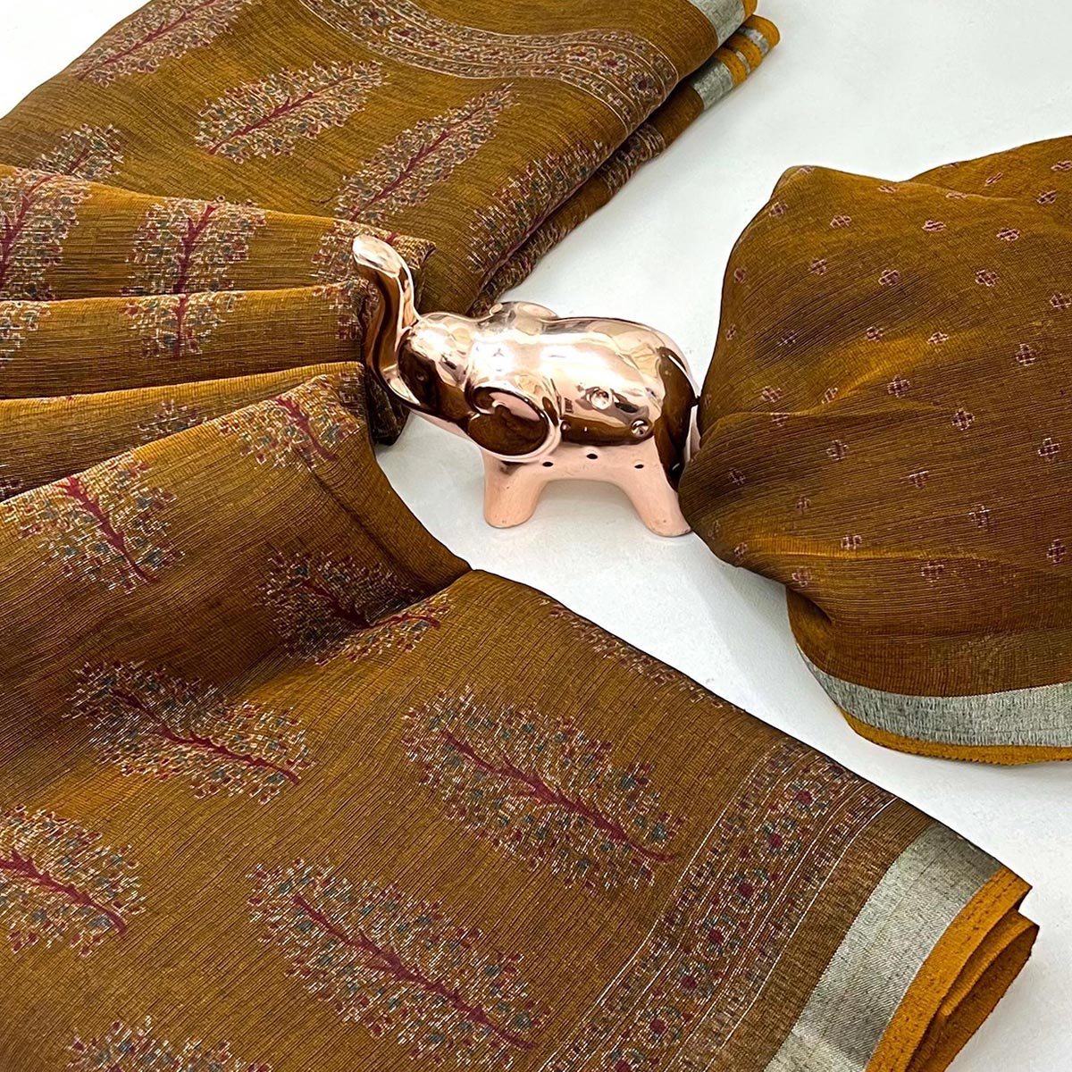 Classic Mustard Linen Cotton Saree Featuring Floral Ajrakh Print & Rich Silver Zari Border