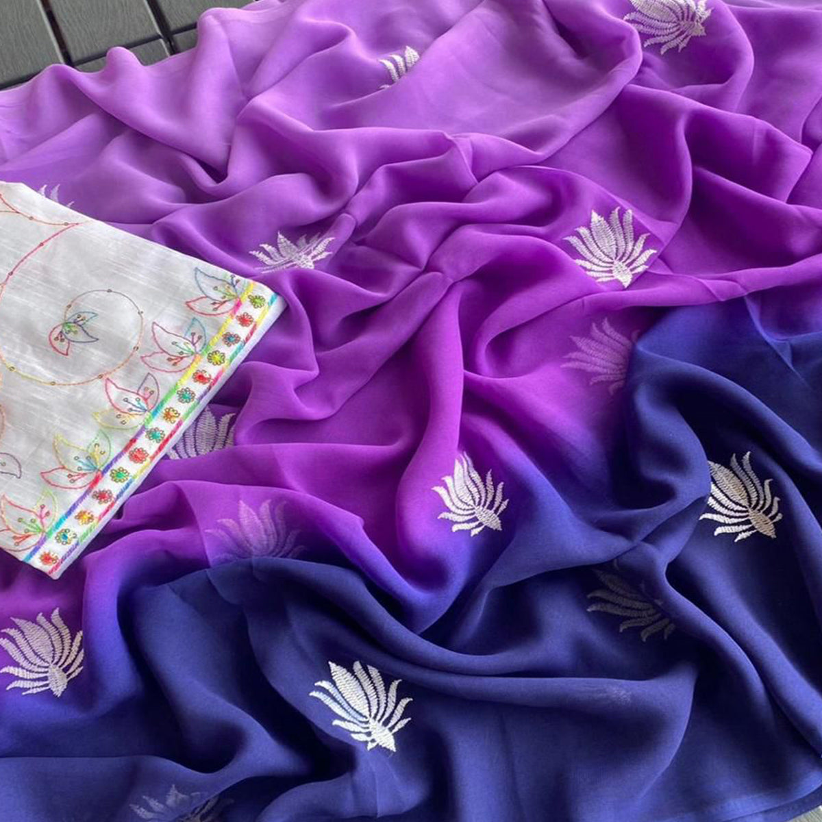 Purple & Blue Floral Embroidered Georgette Saree With Tassels
