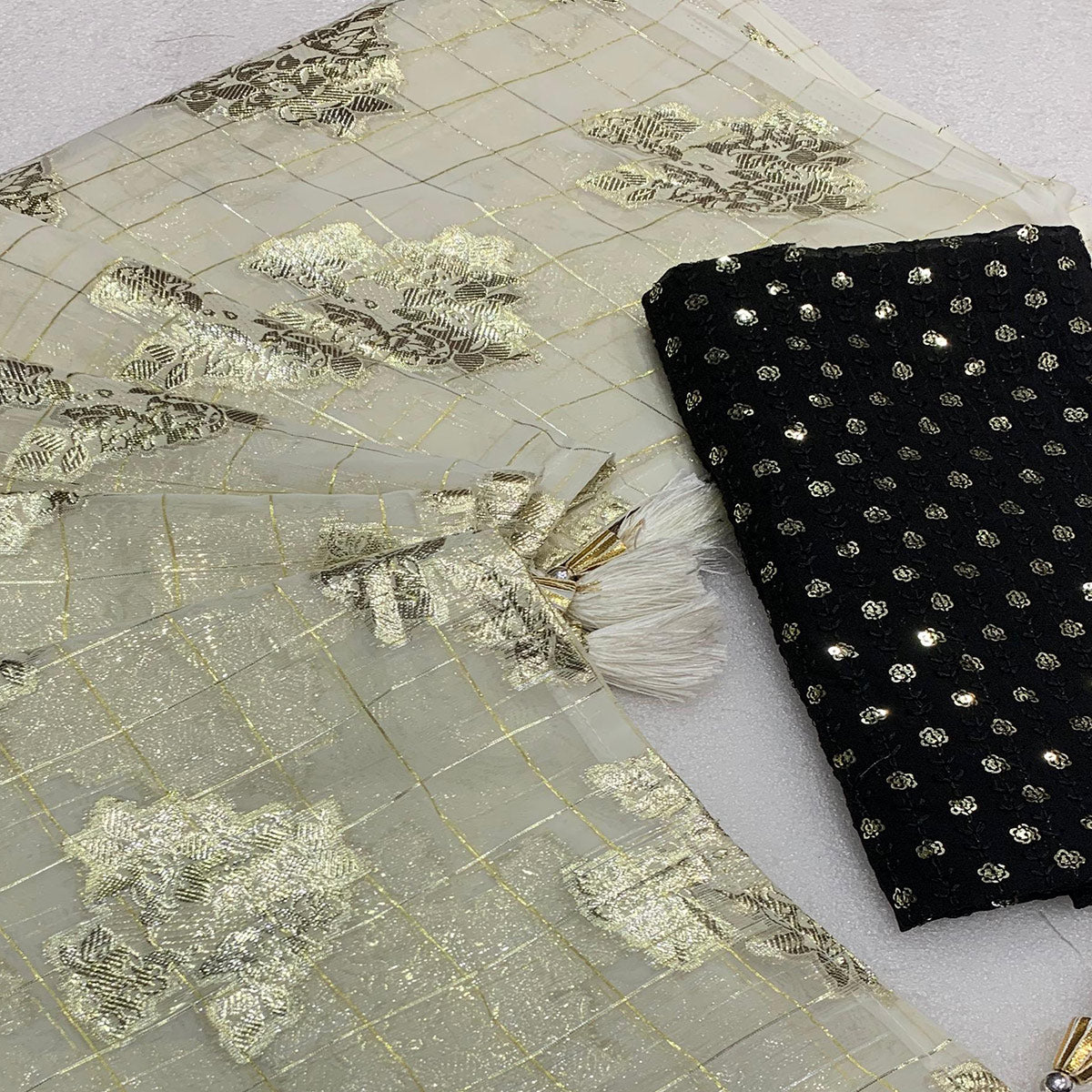 White Floral Woven Georgette Saree With Tassels