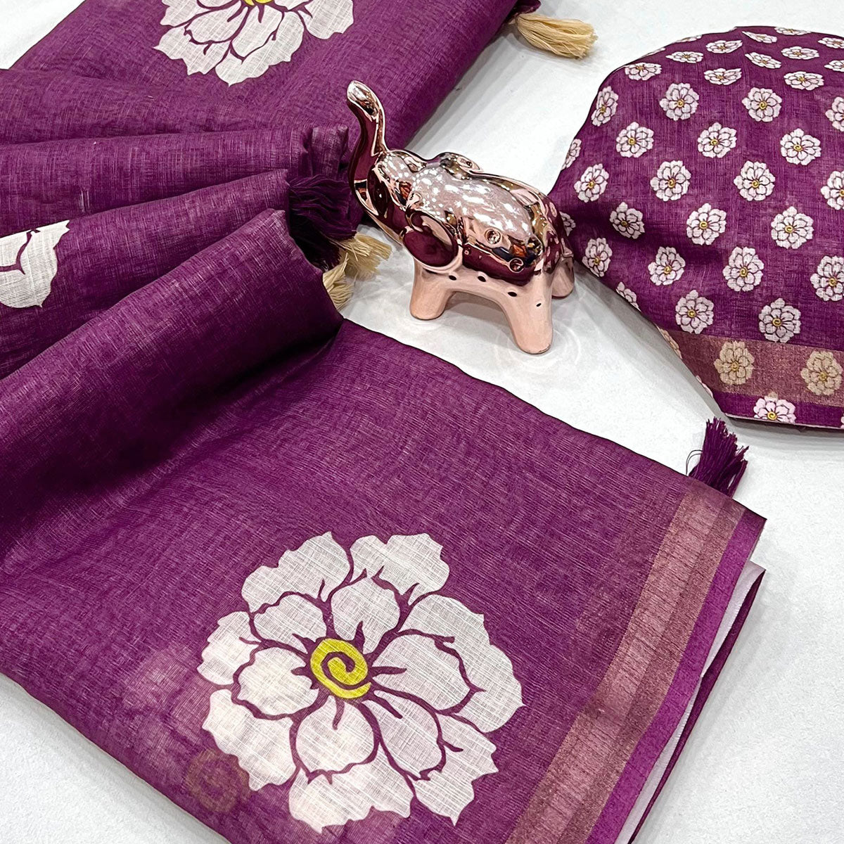 Graceful Purple Floral Printed Saree in Linen Silk with Delicate Tassel Accents