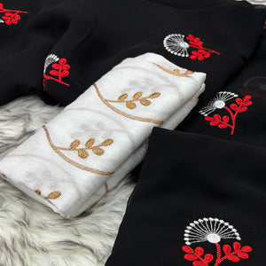 Black Floral Embroidered Georgette Saree With Tassels