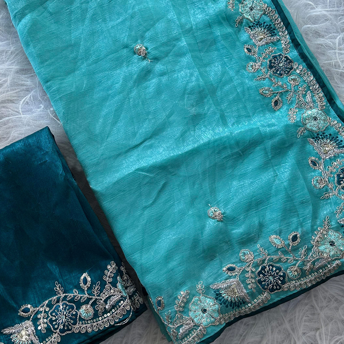 Blue Pure Silk Saree Showcasing Floral Sequins Embroidery With A Decorative Tassel Pallu