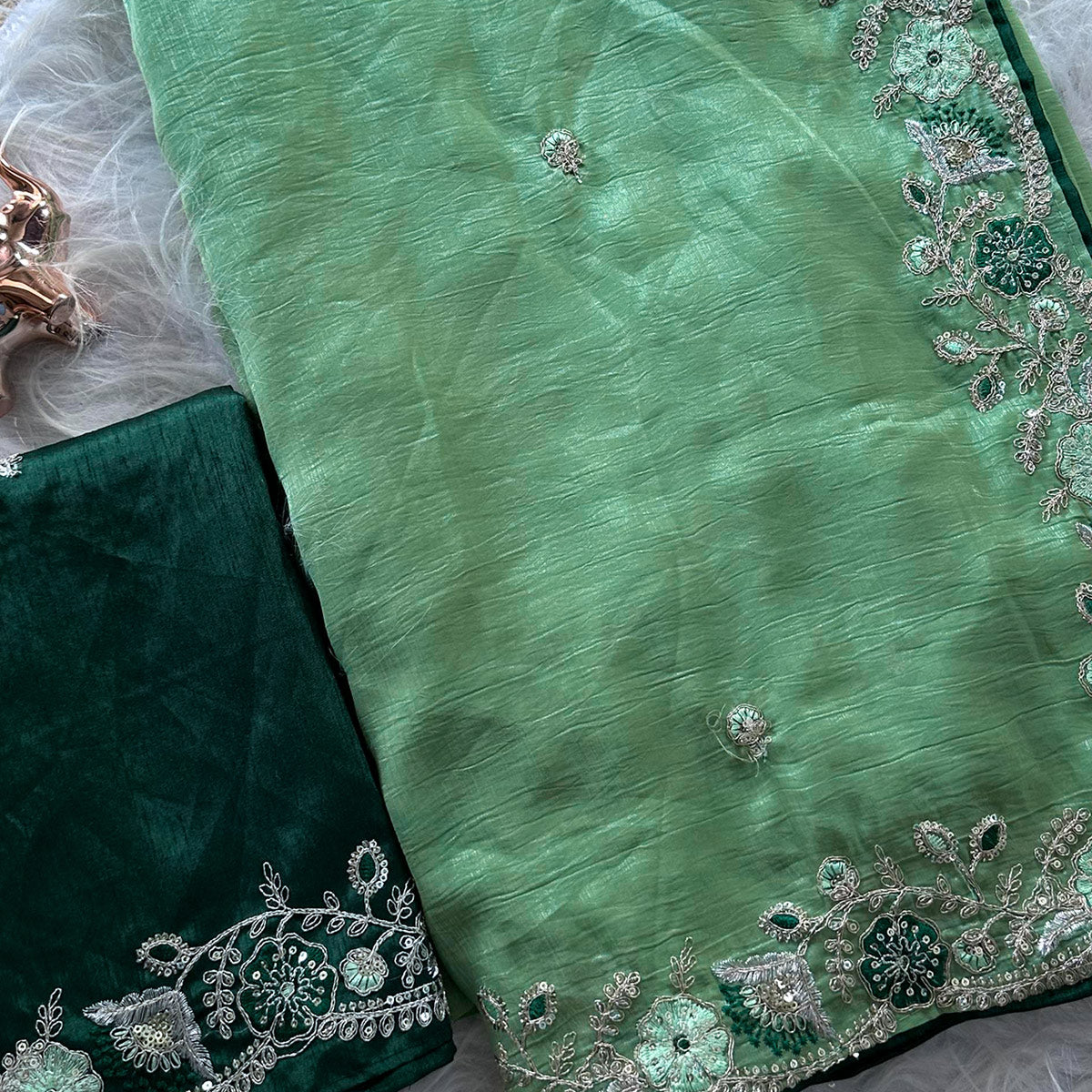 Green Pure Silk Saree Showcasing Floral Sequins Embroidery With A Decorative Tassel Pallu