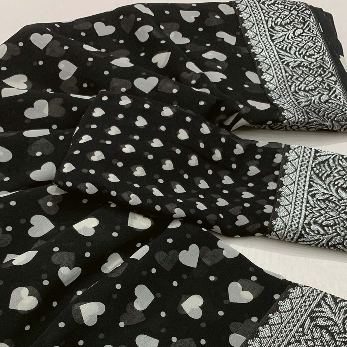 Black Heart Printed Georgette Saree With Woven Border