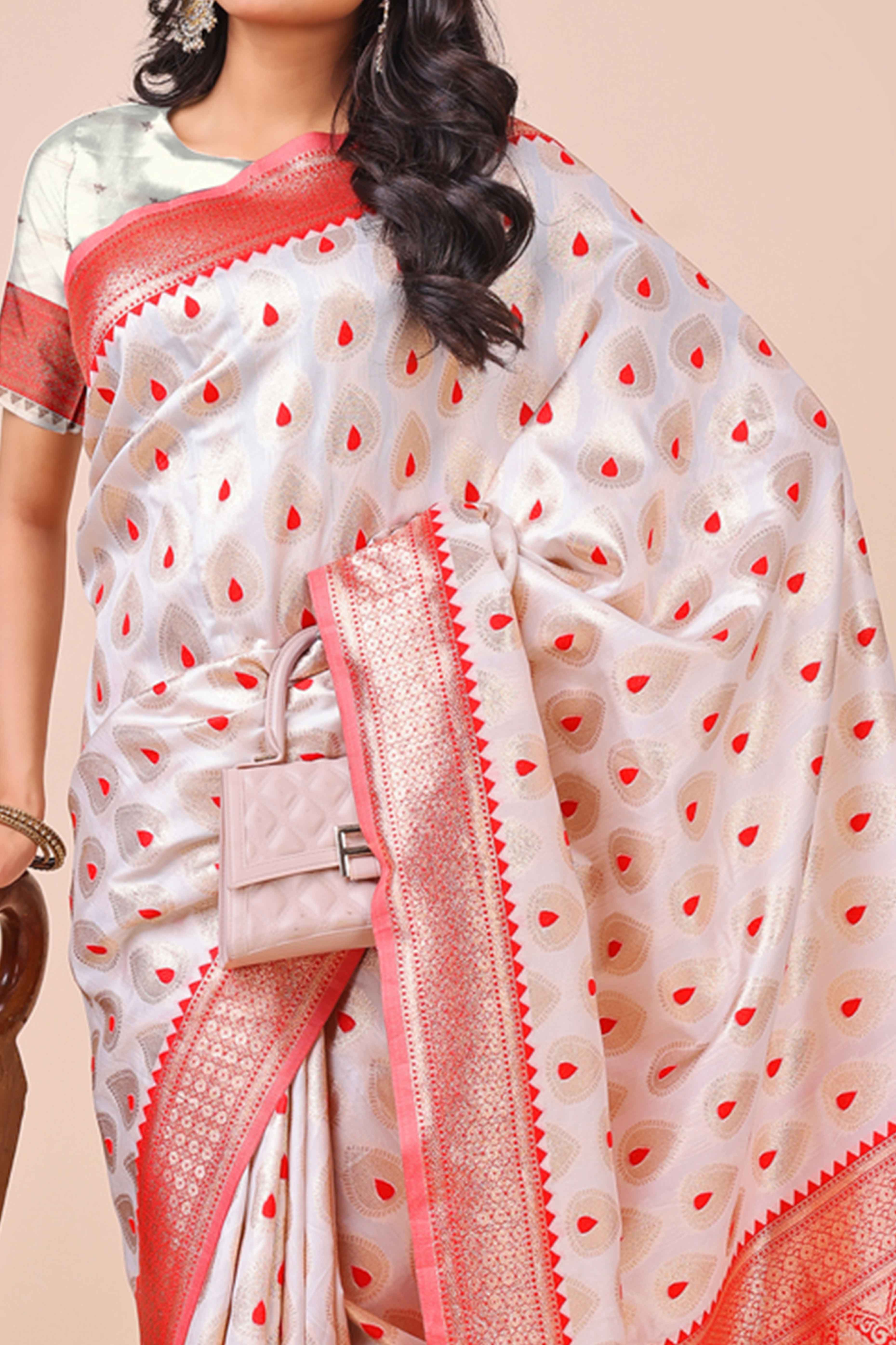White Banarasi Silk Saree With Intricate Floral Weave & Elegant Tassel Accents