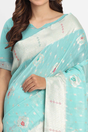 Shimmering Turquoise linen Cotton Saree Embellished With Rich Zari Weaving And Tassels Pallu