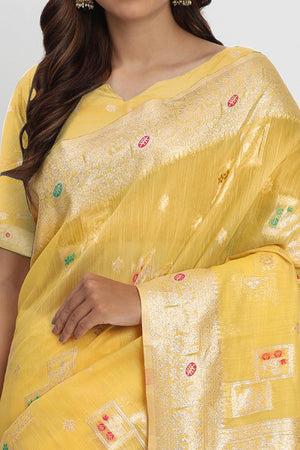 Floral Zari Weaving Brings Regal Beauty To This Yellow Linen Cotton Saree With Tassel Accents