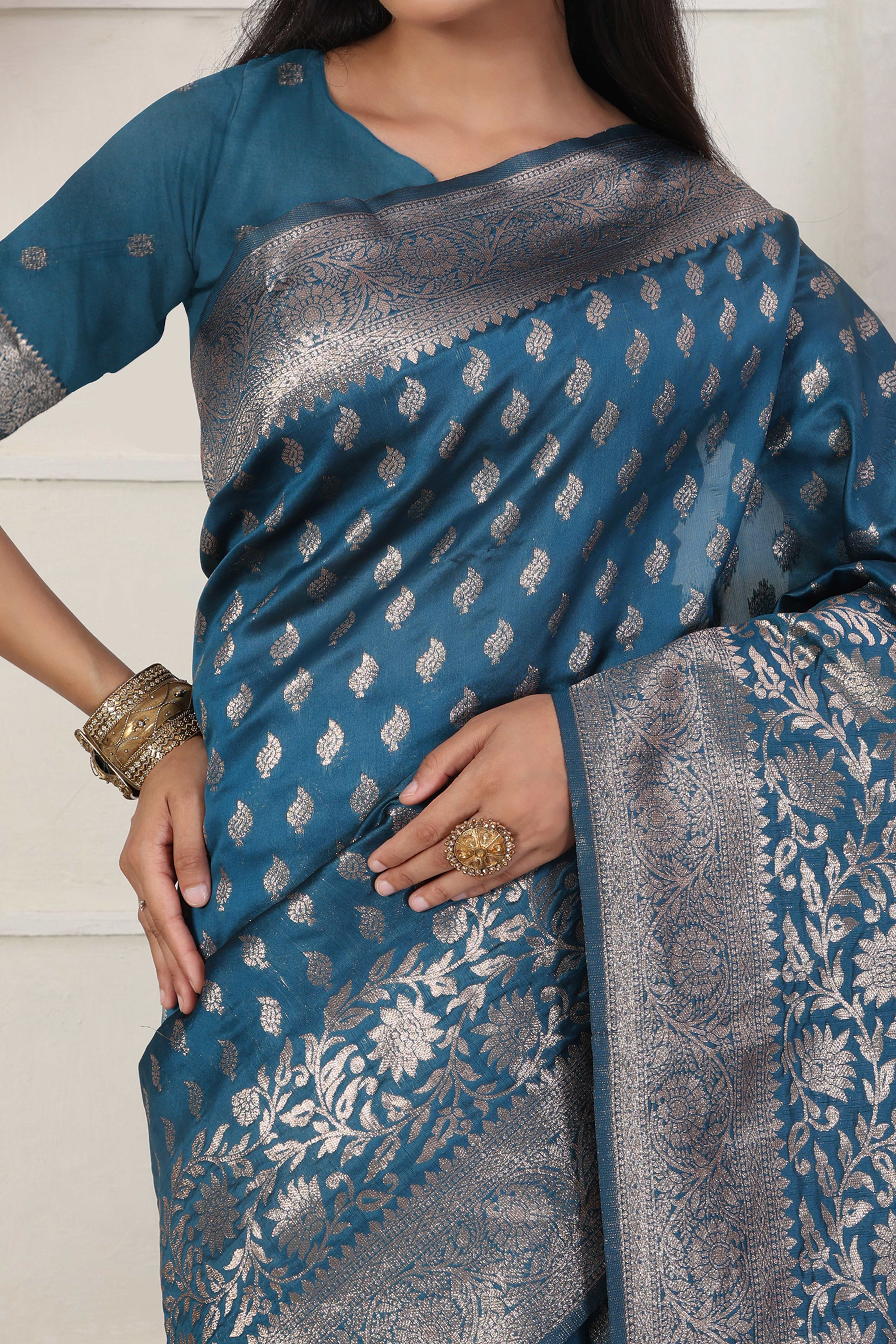 Blue Traditional Lichi Silk Blend Saree Enhanced With Floral Zari Weaving & Tassel Pallu