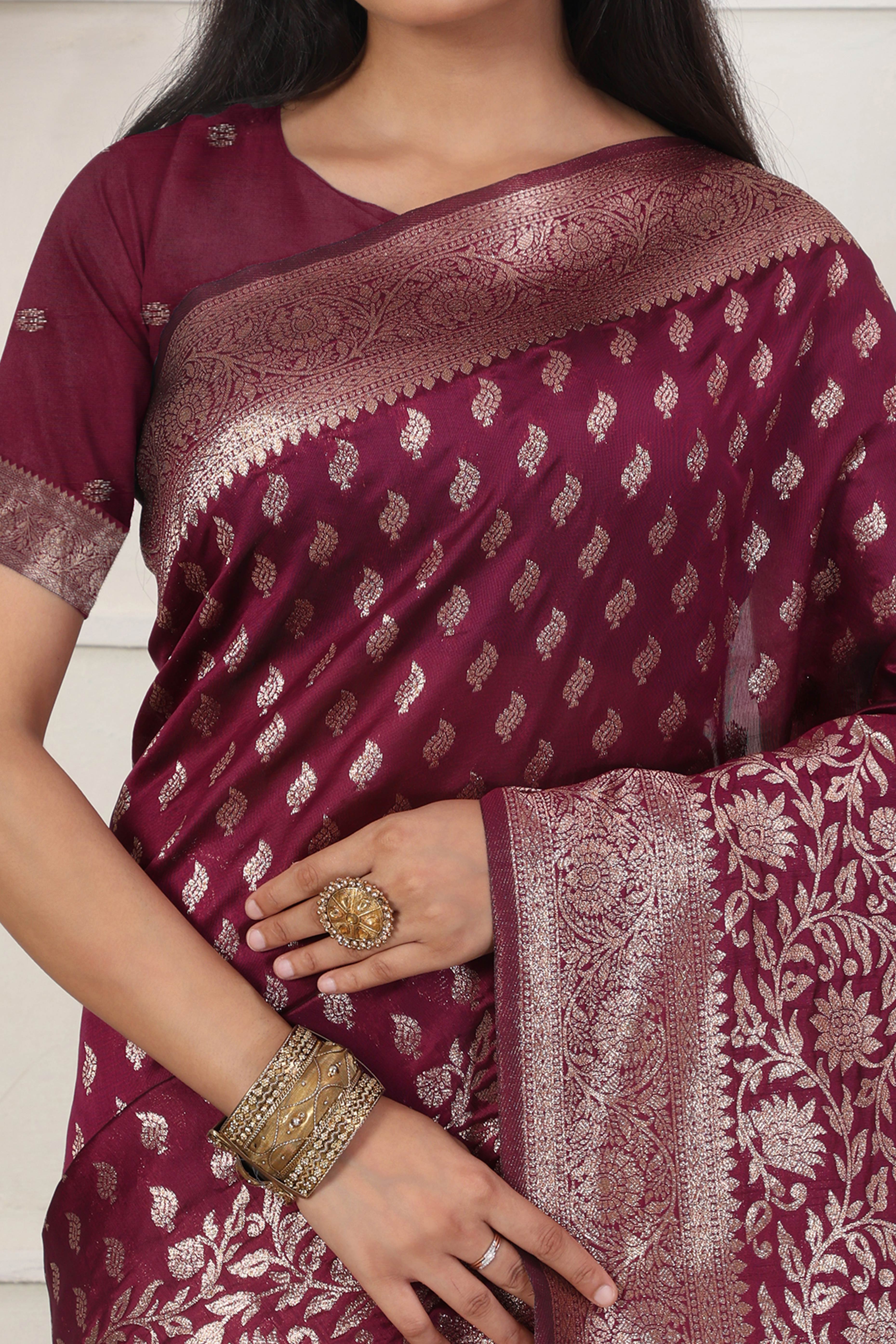 Wine Traditional Lichi Silk Blend Saree Enhanced With Floral Zari Weaving & Tassel Pallu