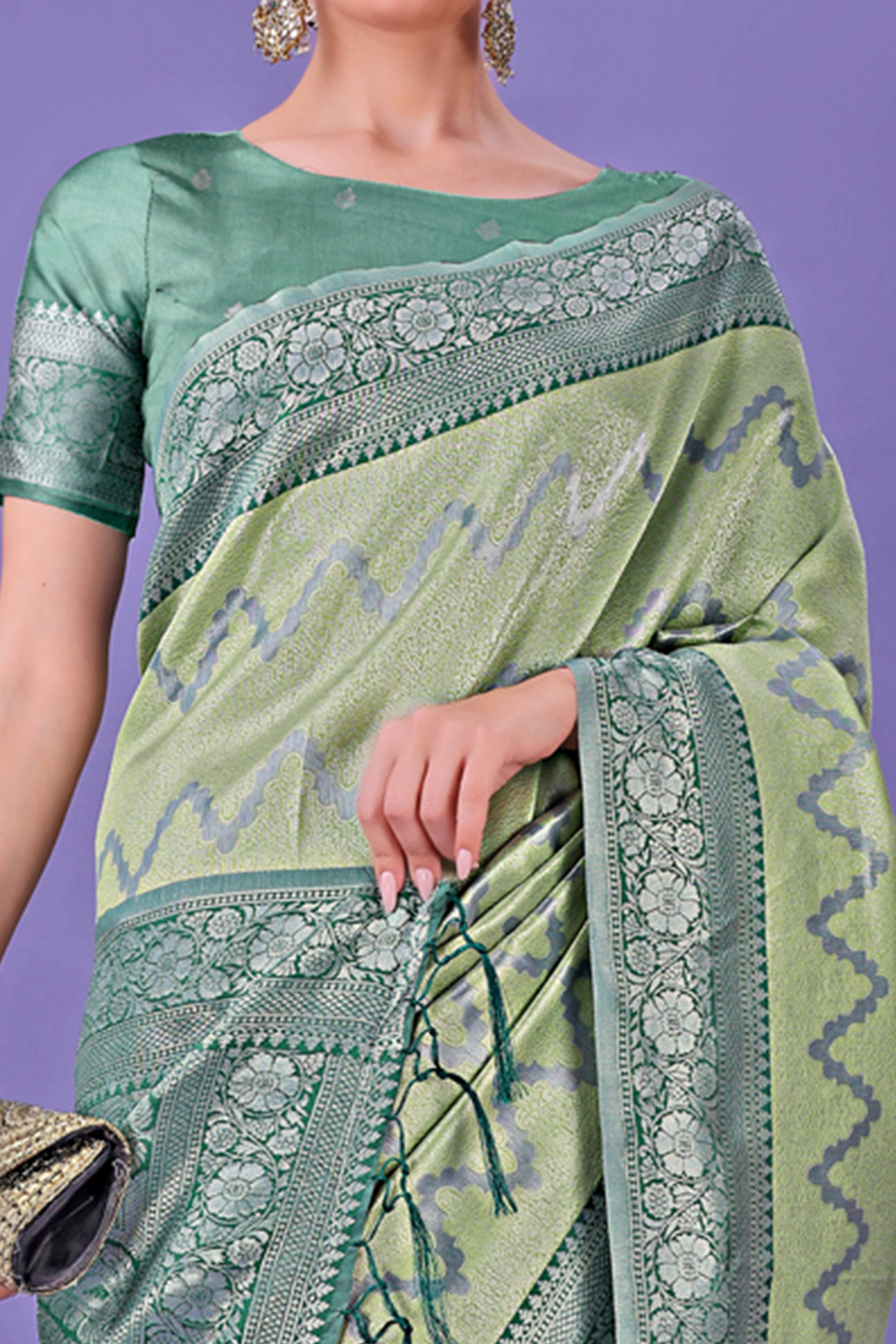 Light Green Lichi Cotton Silk Saree Adorned With Floral Zari Weave & Tassels