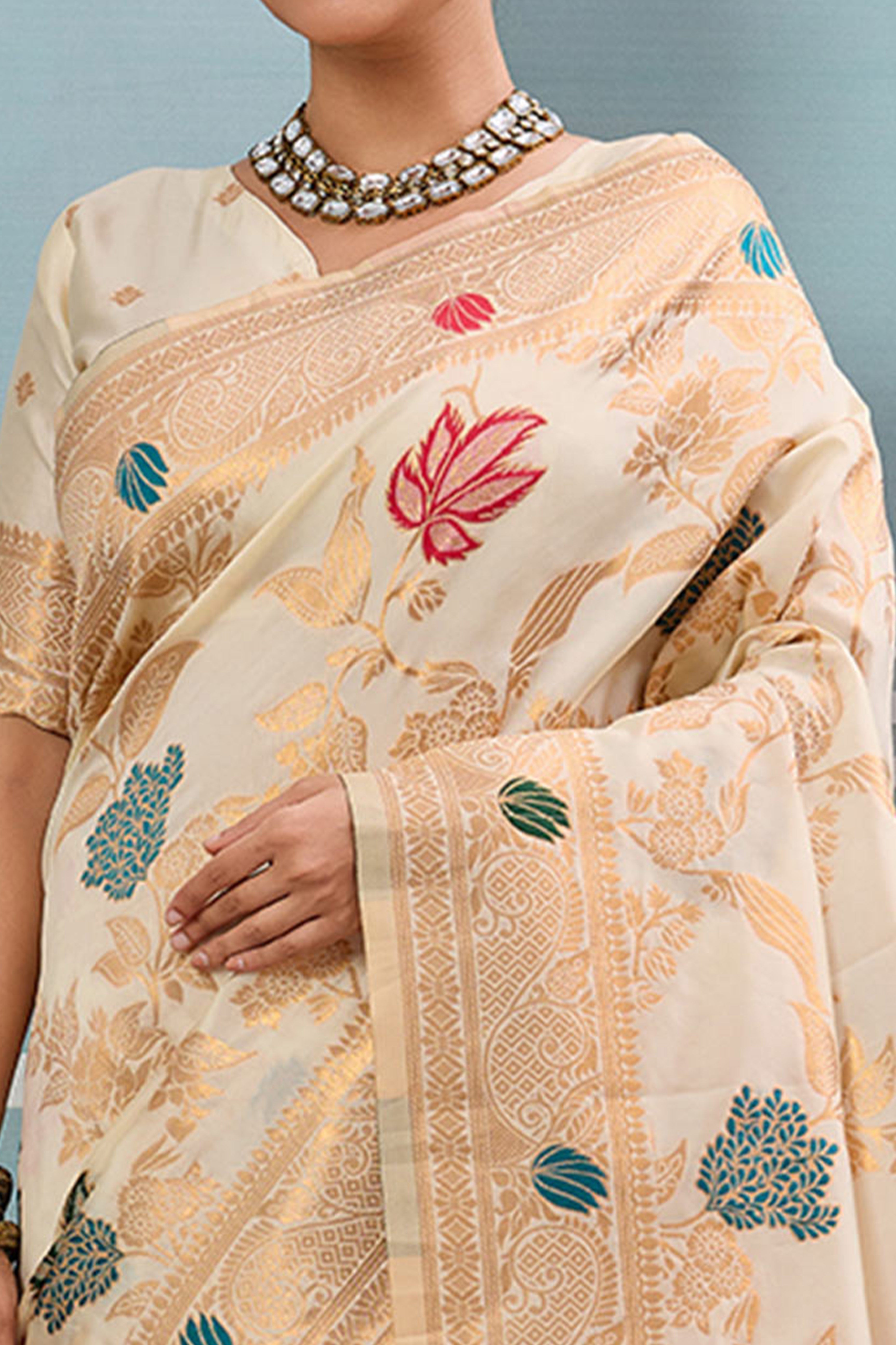 Radiant Cream Silk Blend Saree Adorned With Intricate Floral Zari Weaving & Tassel Pallu
