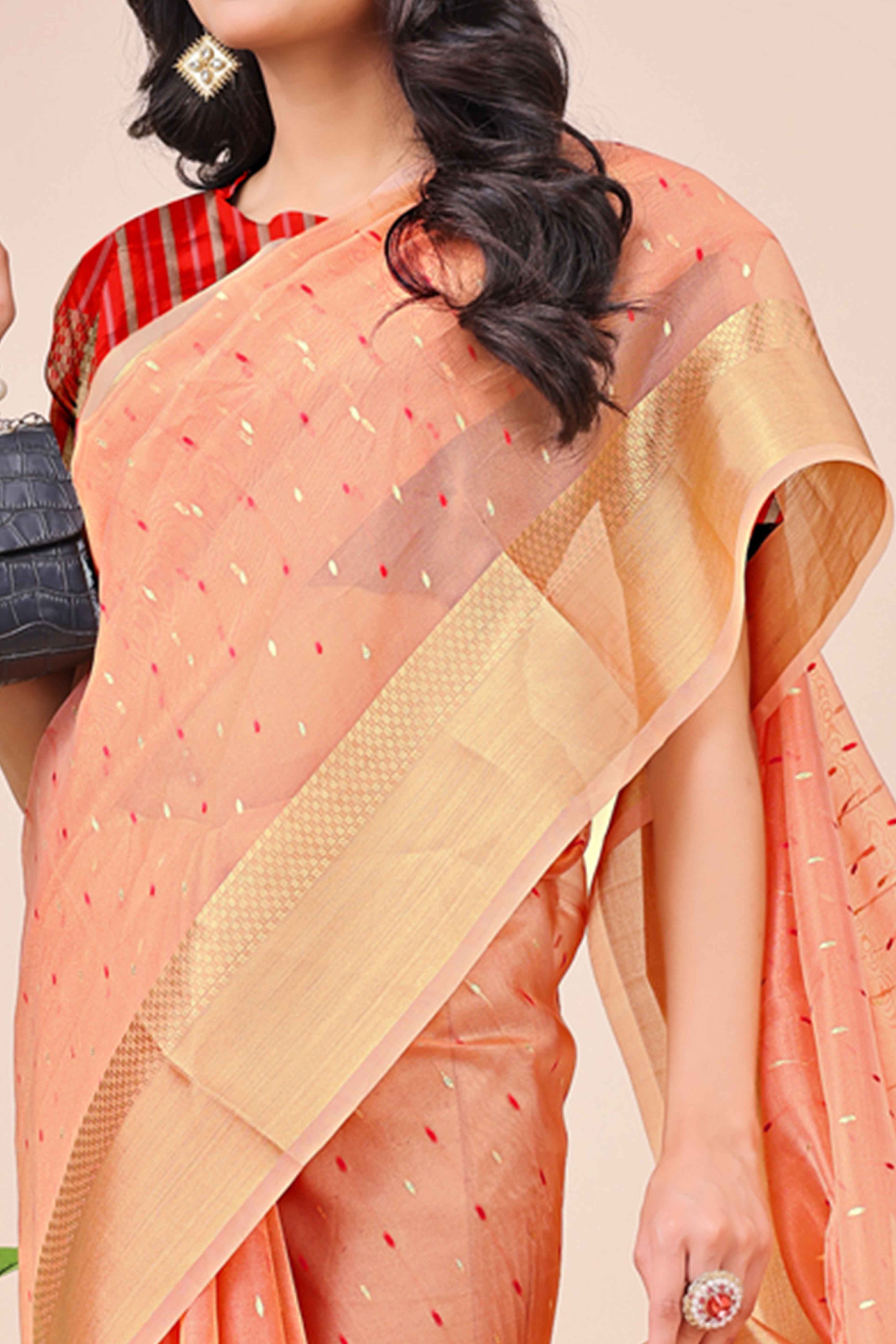 Peach Organza Saree Adorned With Fine Zari Weaving & Stylish Tassel Edging
