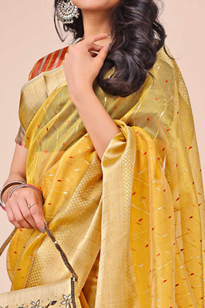 Yellow Organza Saree Adorned With Fine Zari Weaving & Stylish Tassel Edging