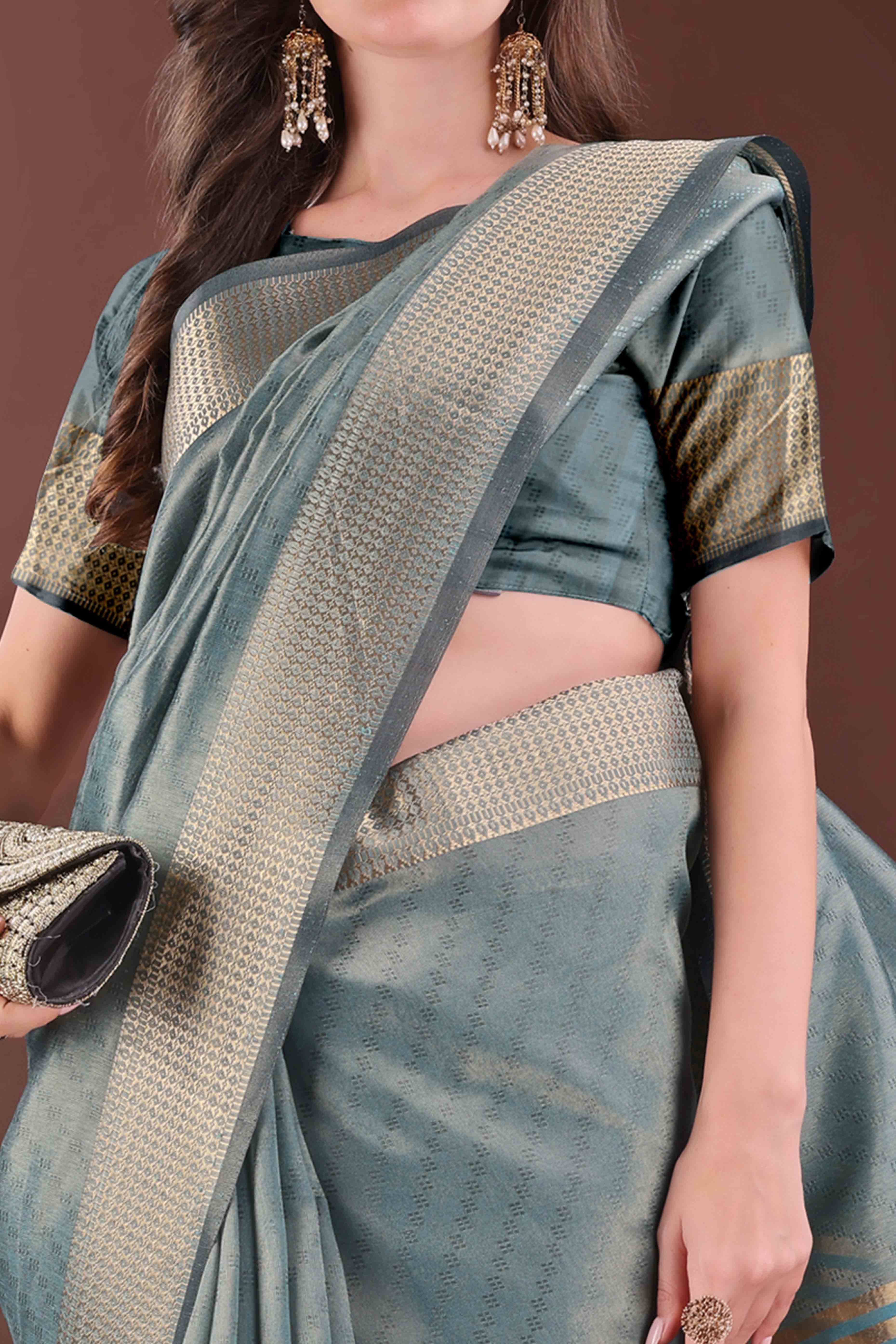 Peacock Blue Zari Weaving Organza Saree With Tassel Border