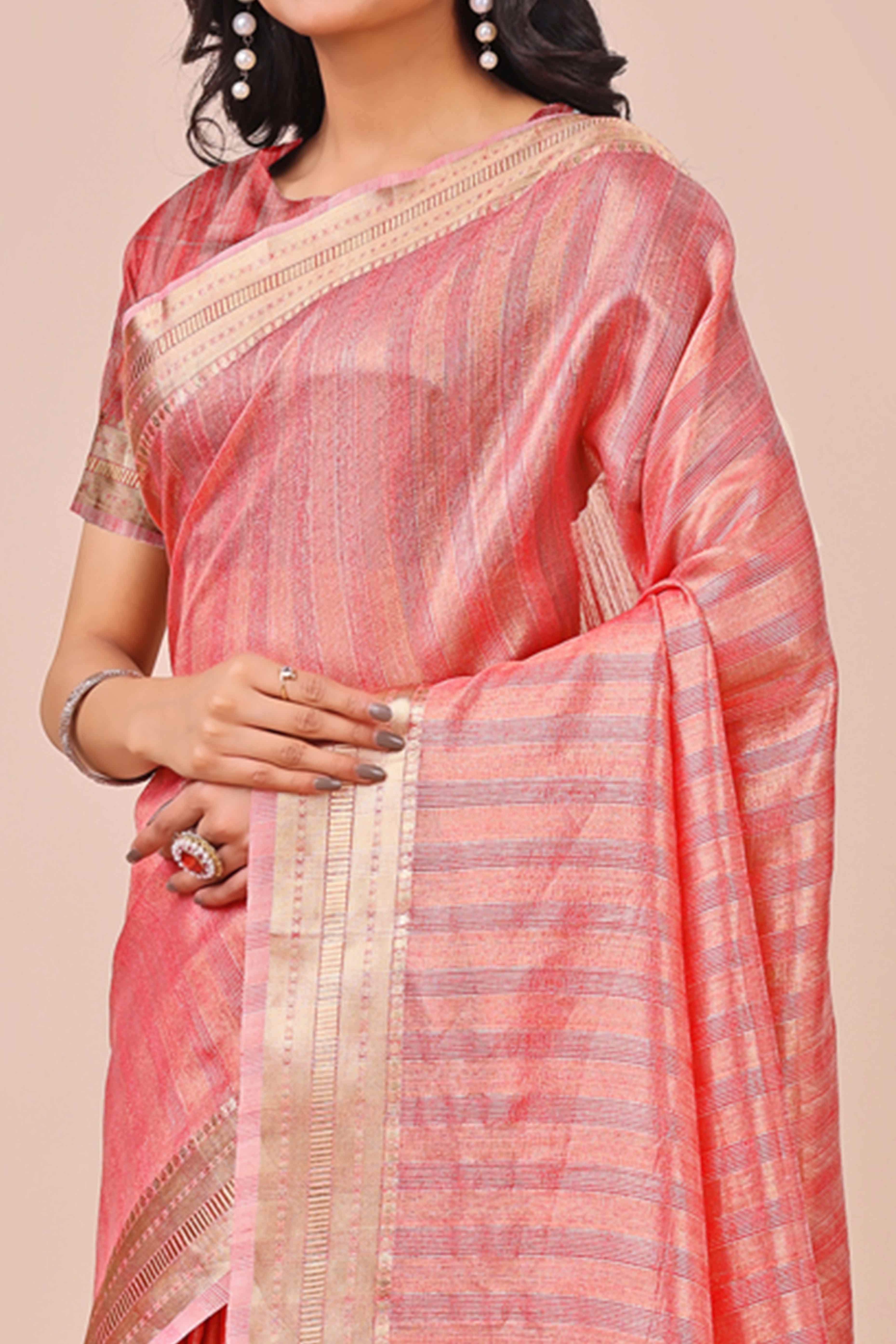 Coral Pink Organza Saree With Intricate Weave & Elegant Tassel Accents