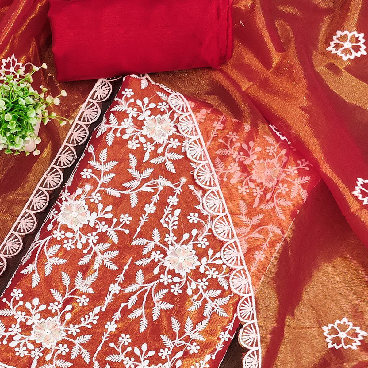 Stunning Rust Dress Material Adorned with Intricate Floral Embroidery