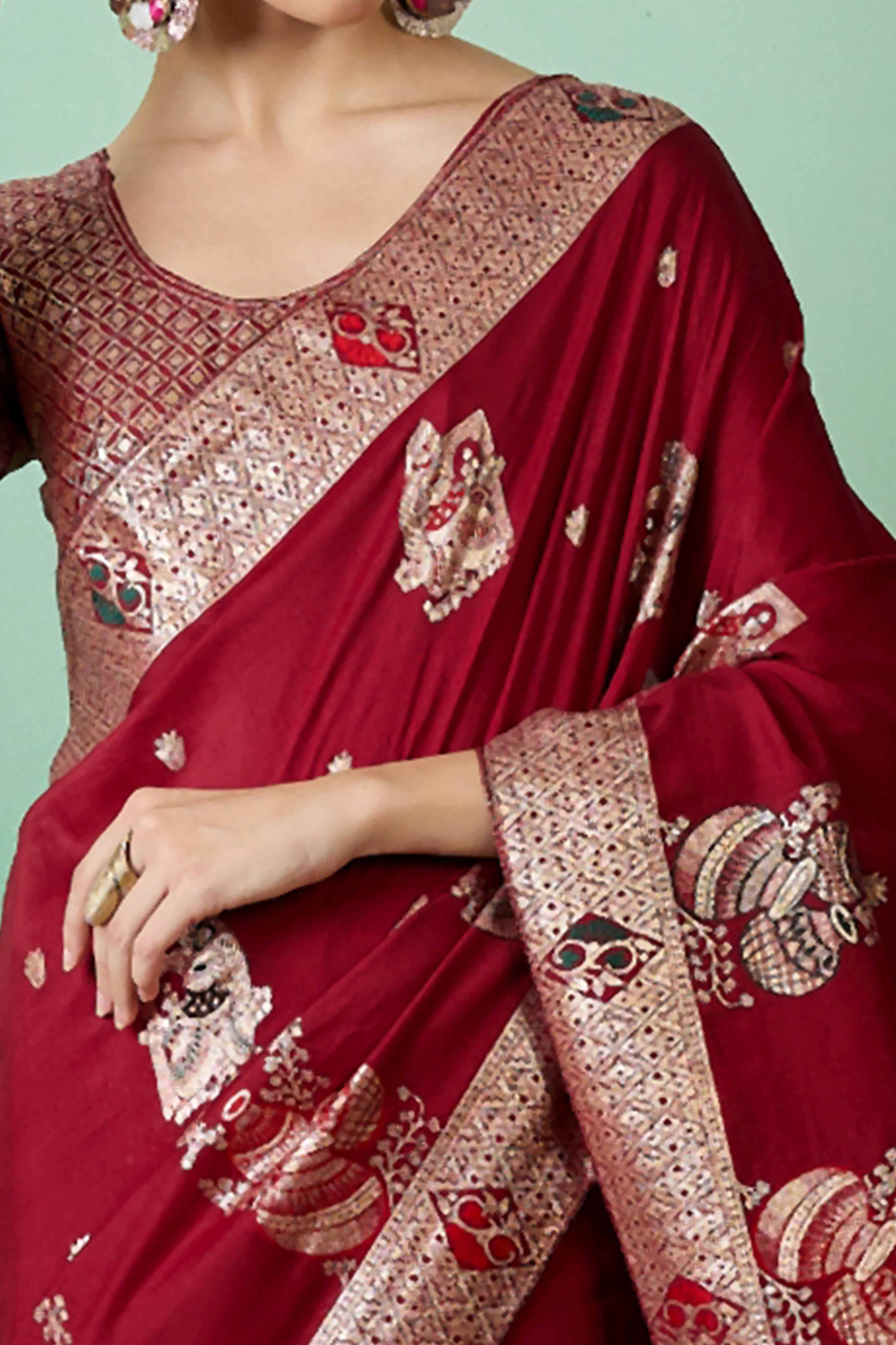 Maroon Cotton Blend Saree Adorned With Floral Zari Weaving & Soft Tassel Accents