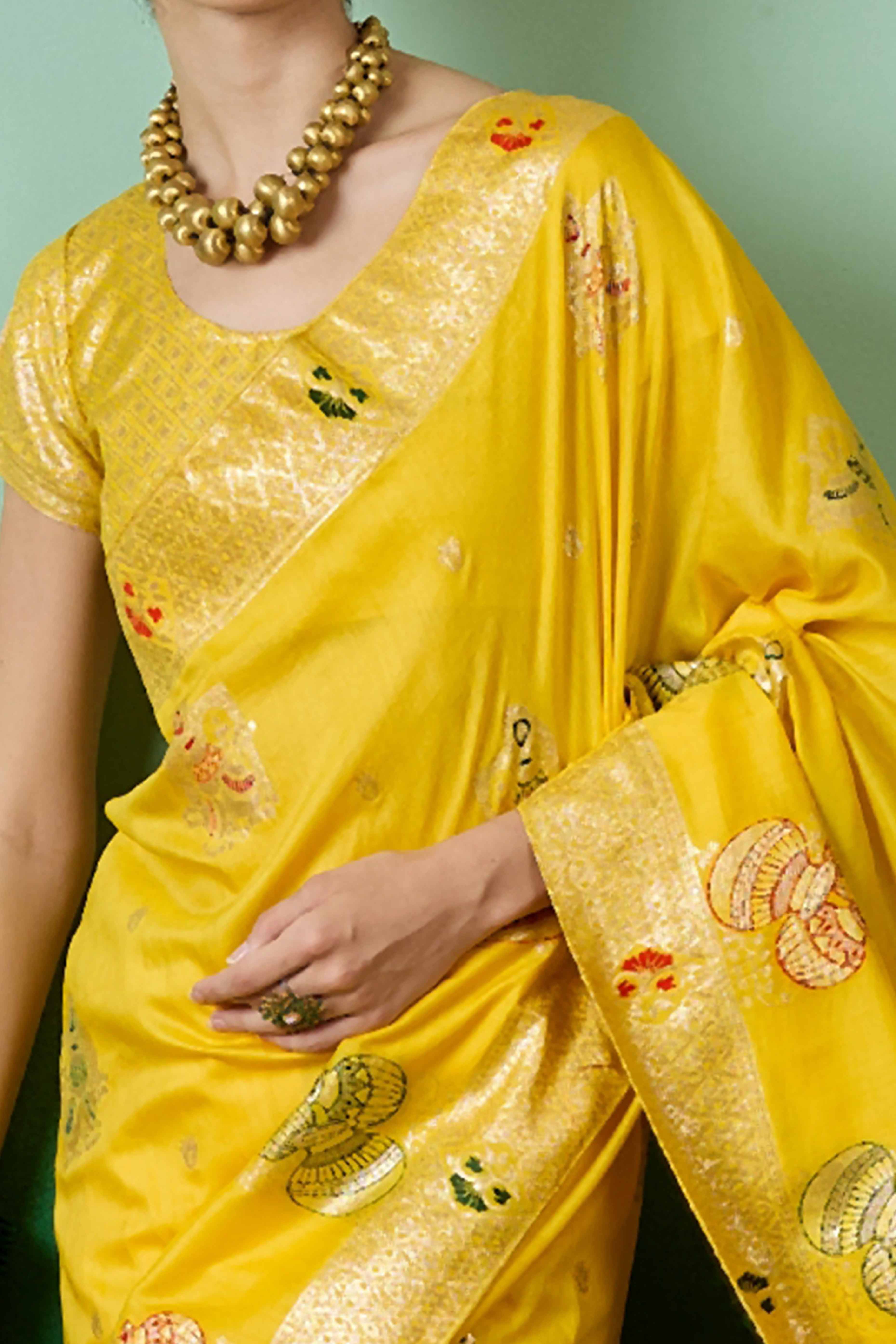 Yellow Cotton Blend Saree Adorned With Floral Zari Weaving & Soft Tassel Accents