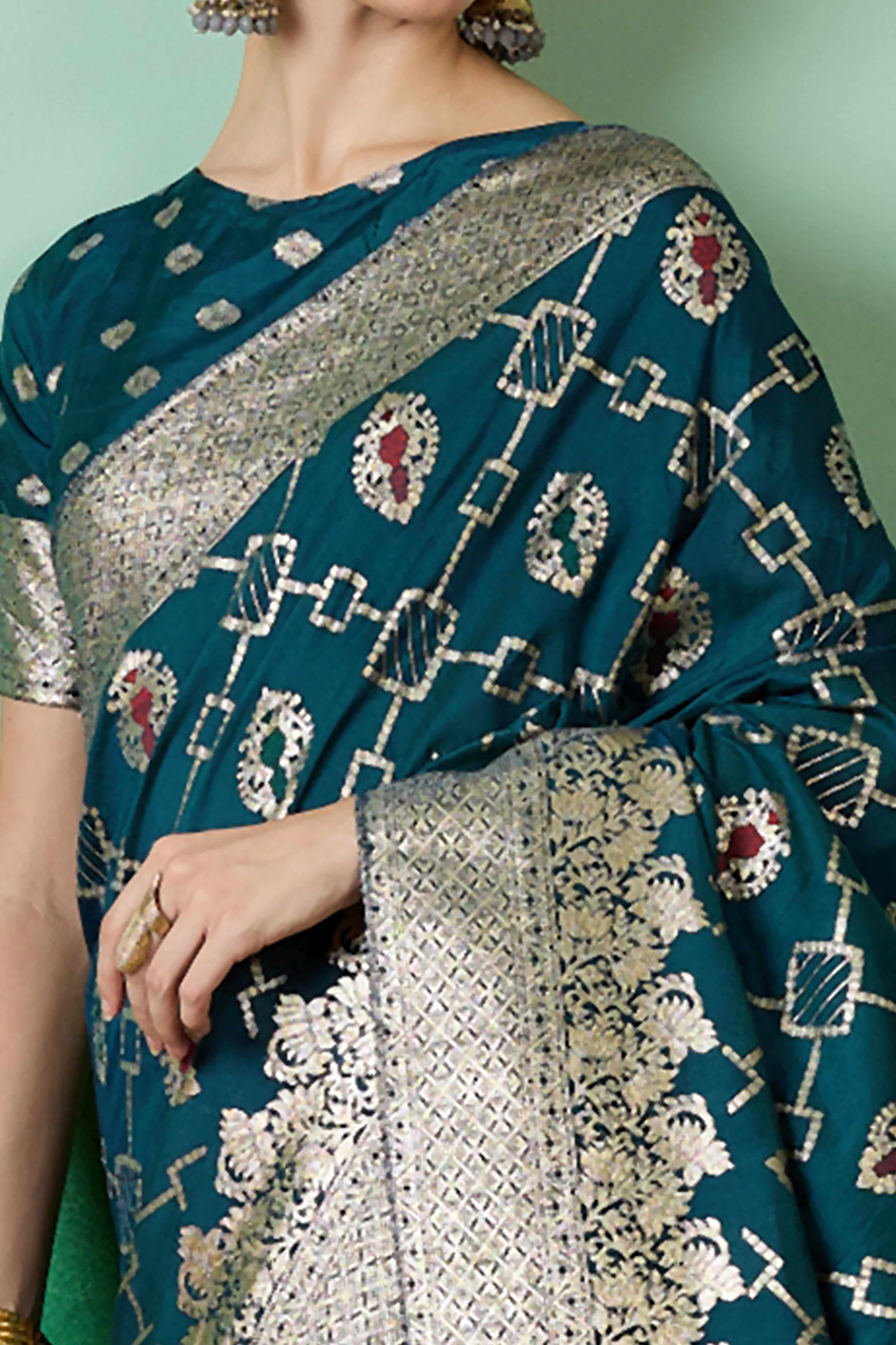 Teal Zari Woven Staple Cotton Blend Saree With Floral Motifs & Tassel Detailed Pallu