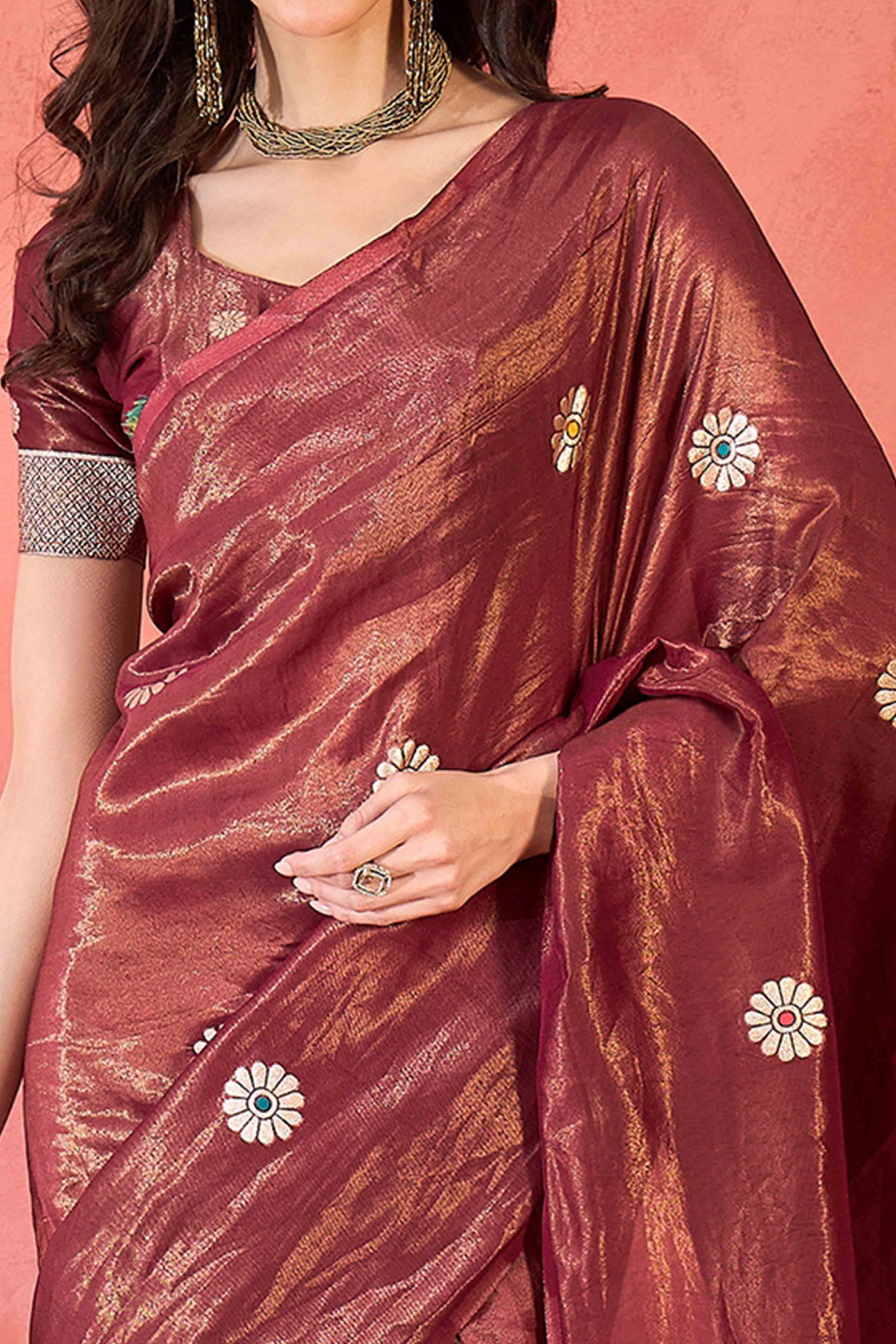 Maroon Shimmer Saree Adorned with Floral Zari Weaving & Tassel Pallu