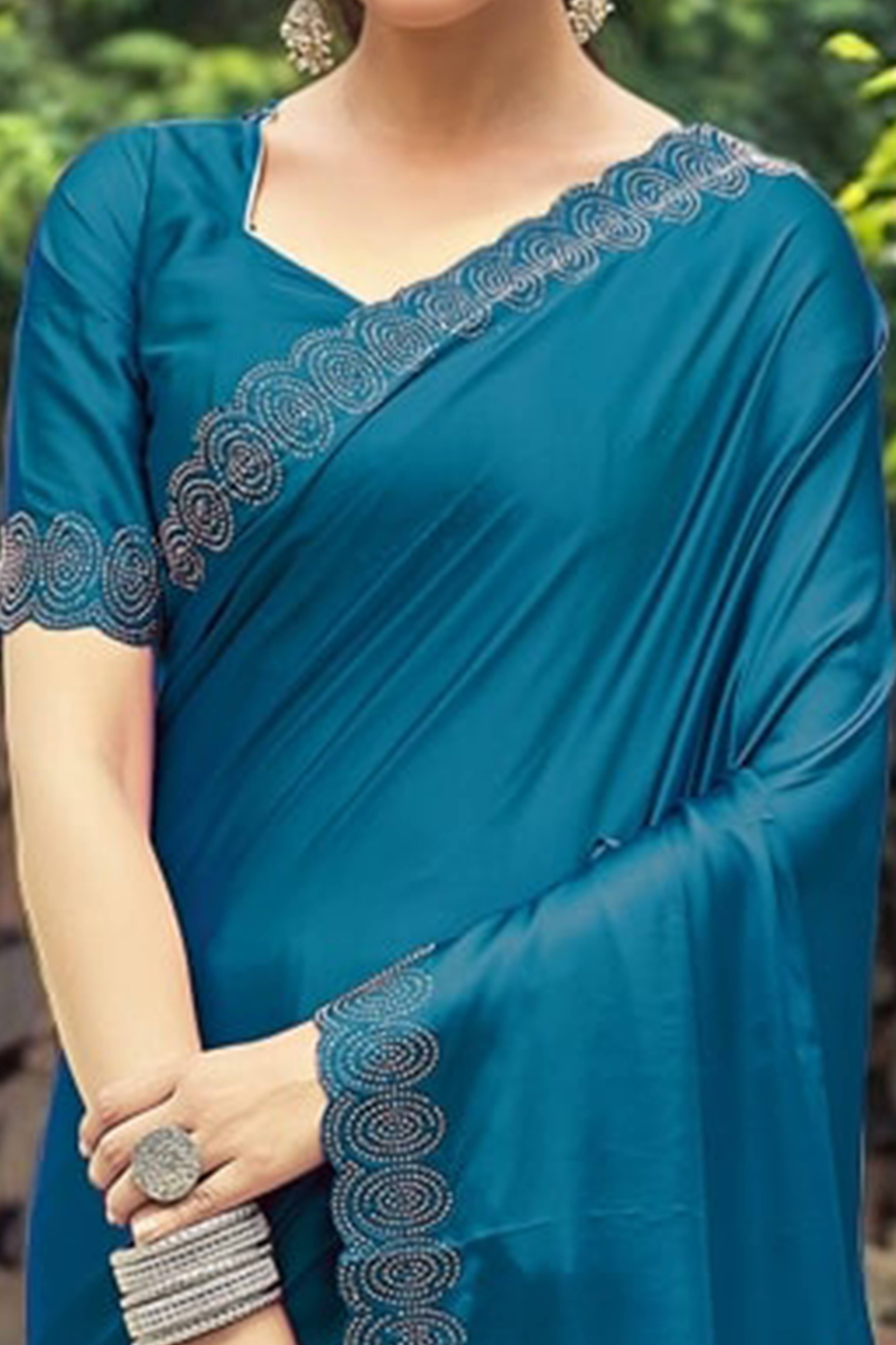 Teal Blue Solid Rangoli Dola Silk Saree Featuring Sparkling Swarovski Work Border
