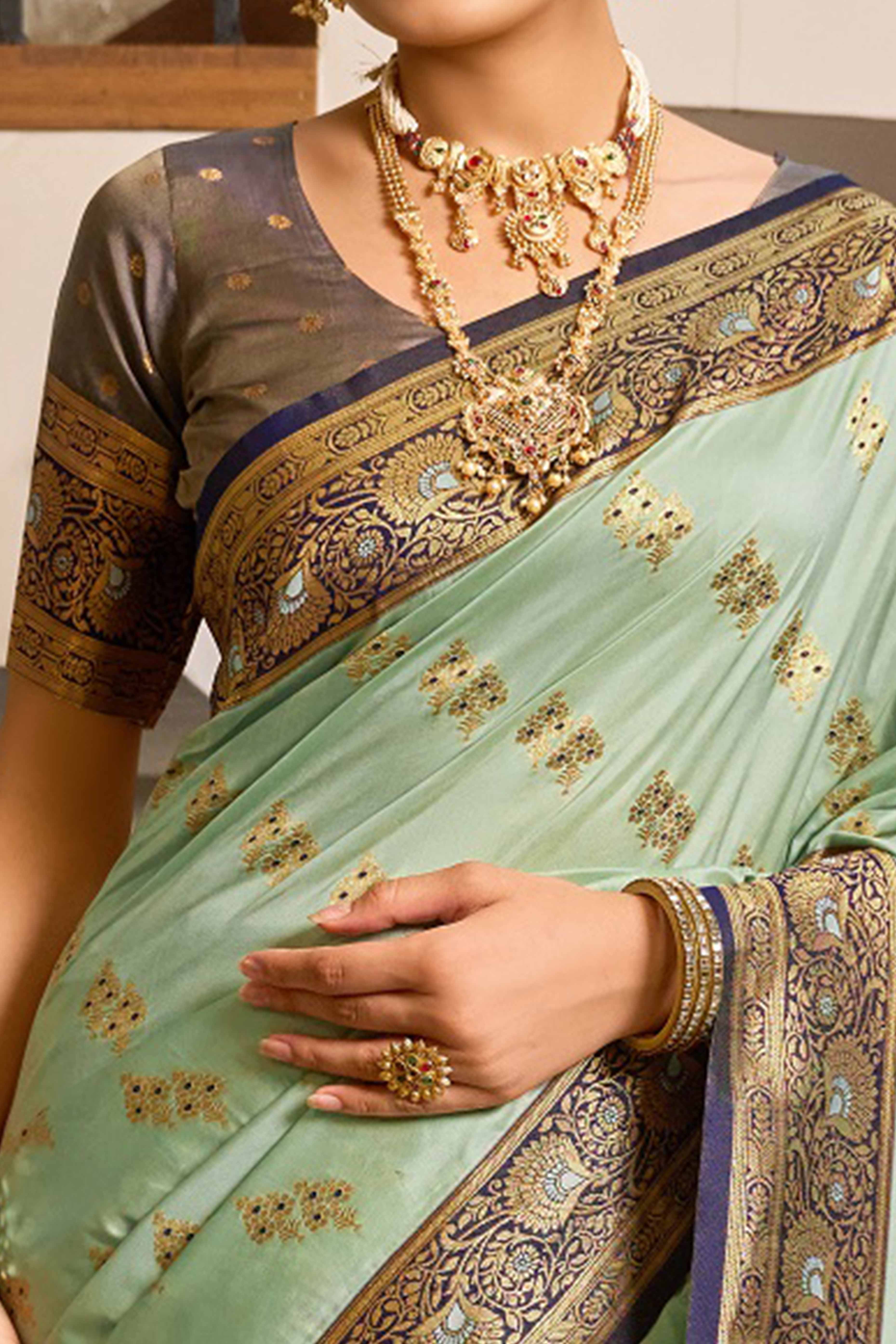 Sea Green Silk Blend Saree Featuring Intricate Floral Zari Work