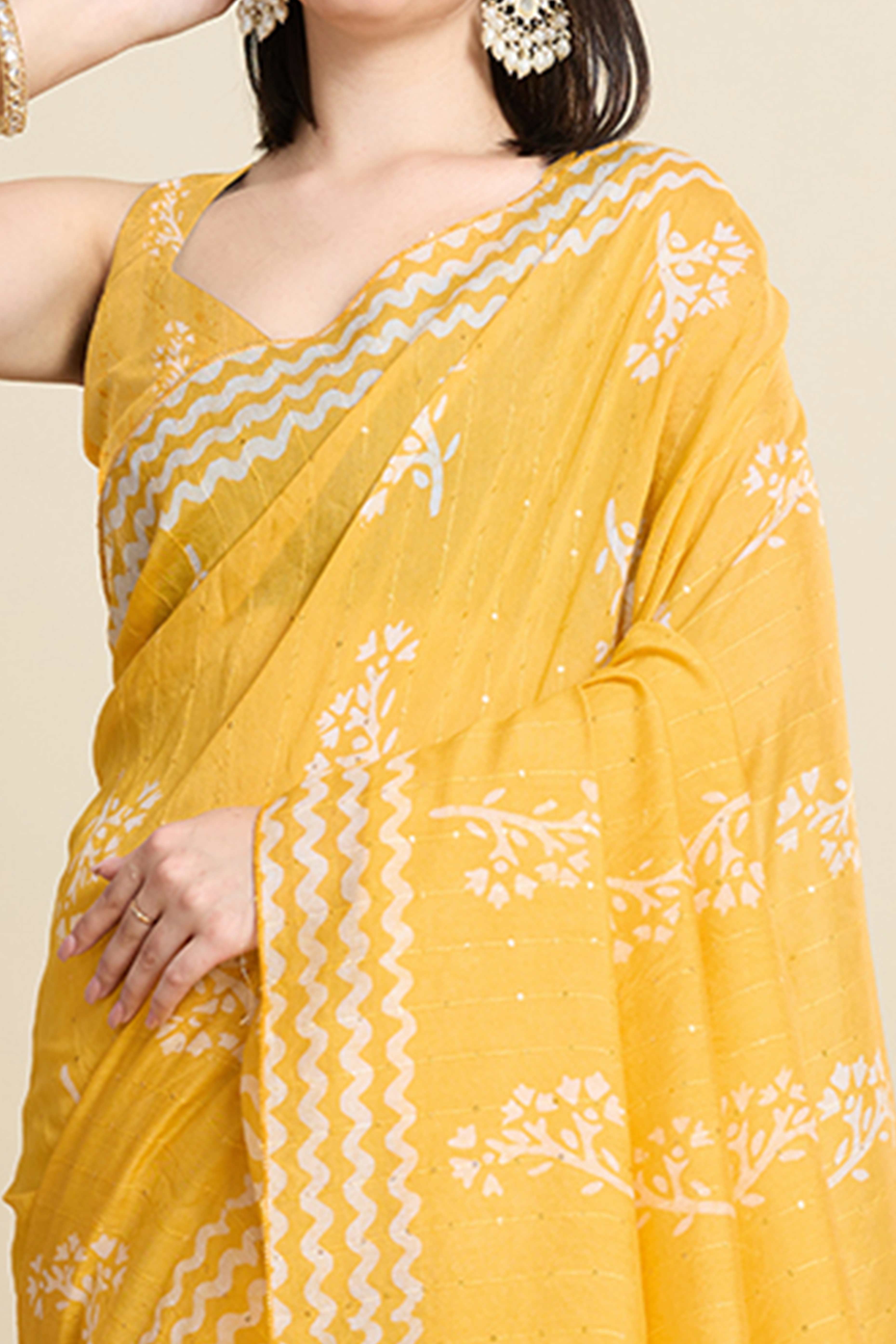 Yellow Cotton Blend Saree Featuring Floral Prints and Elegant Sequins Work Accents