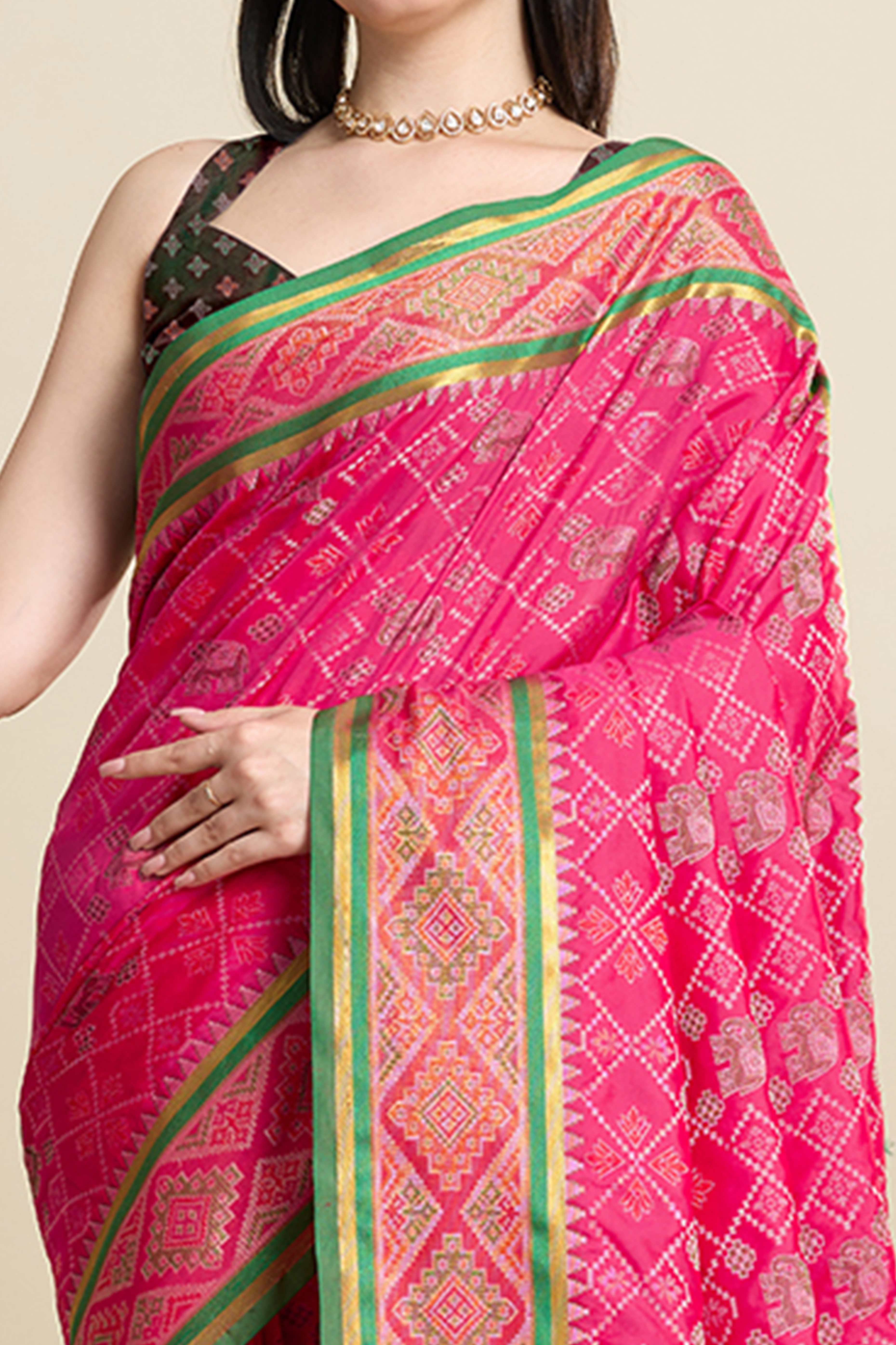 Pink Silk Blend Saree Featuring Patola Prints and a Detailed Weaving Border