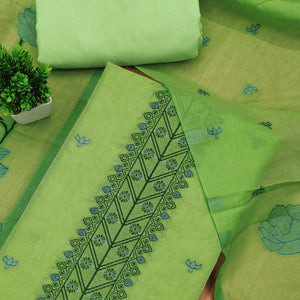 Green Ethnic Dress Material Showcasing Handloom Style Floral Zari Weaving