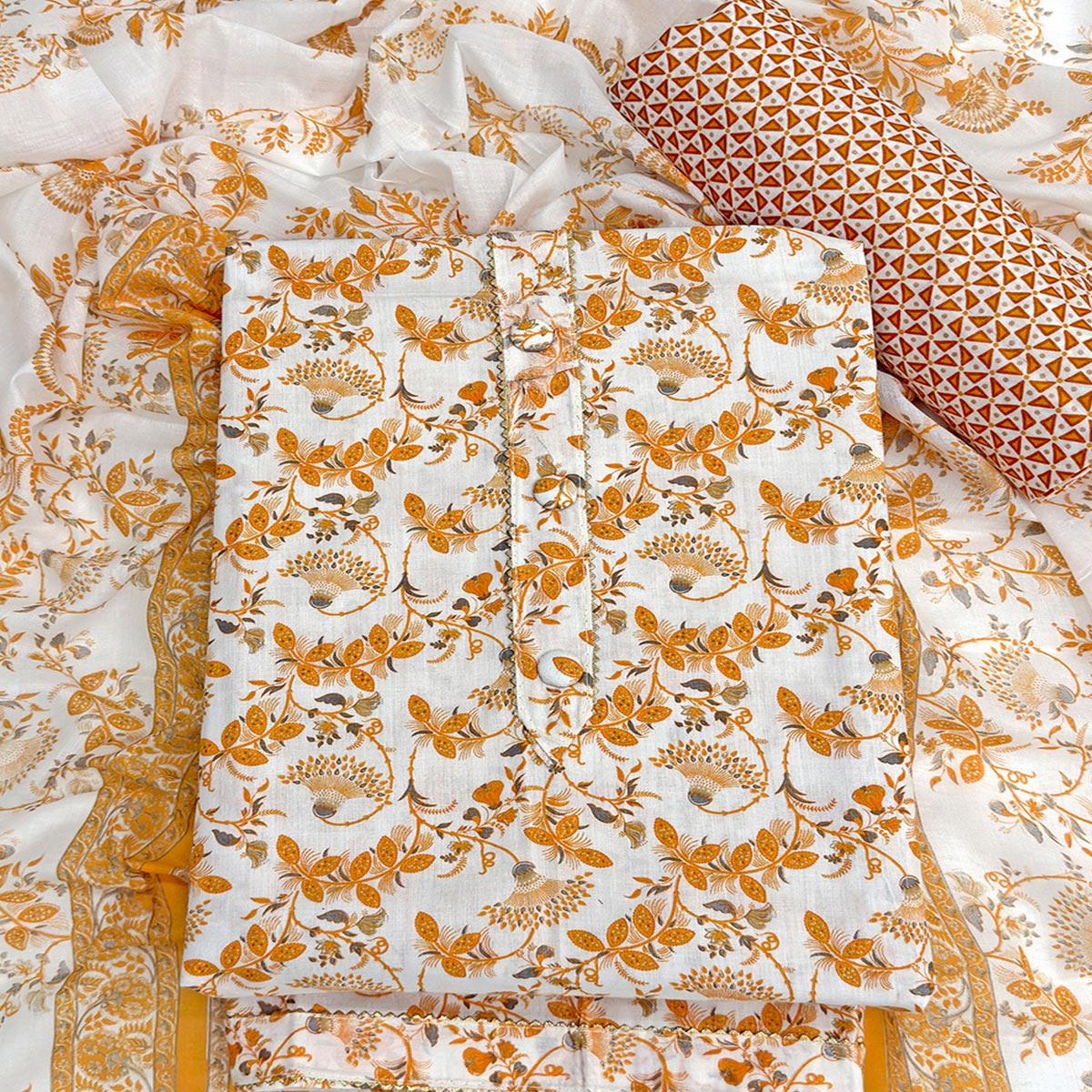 Elegant Mustard Floral Printed Pure Cotton Dress Material With Tie Neck & Fancy Button